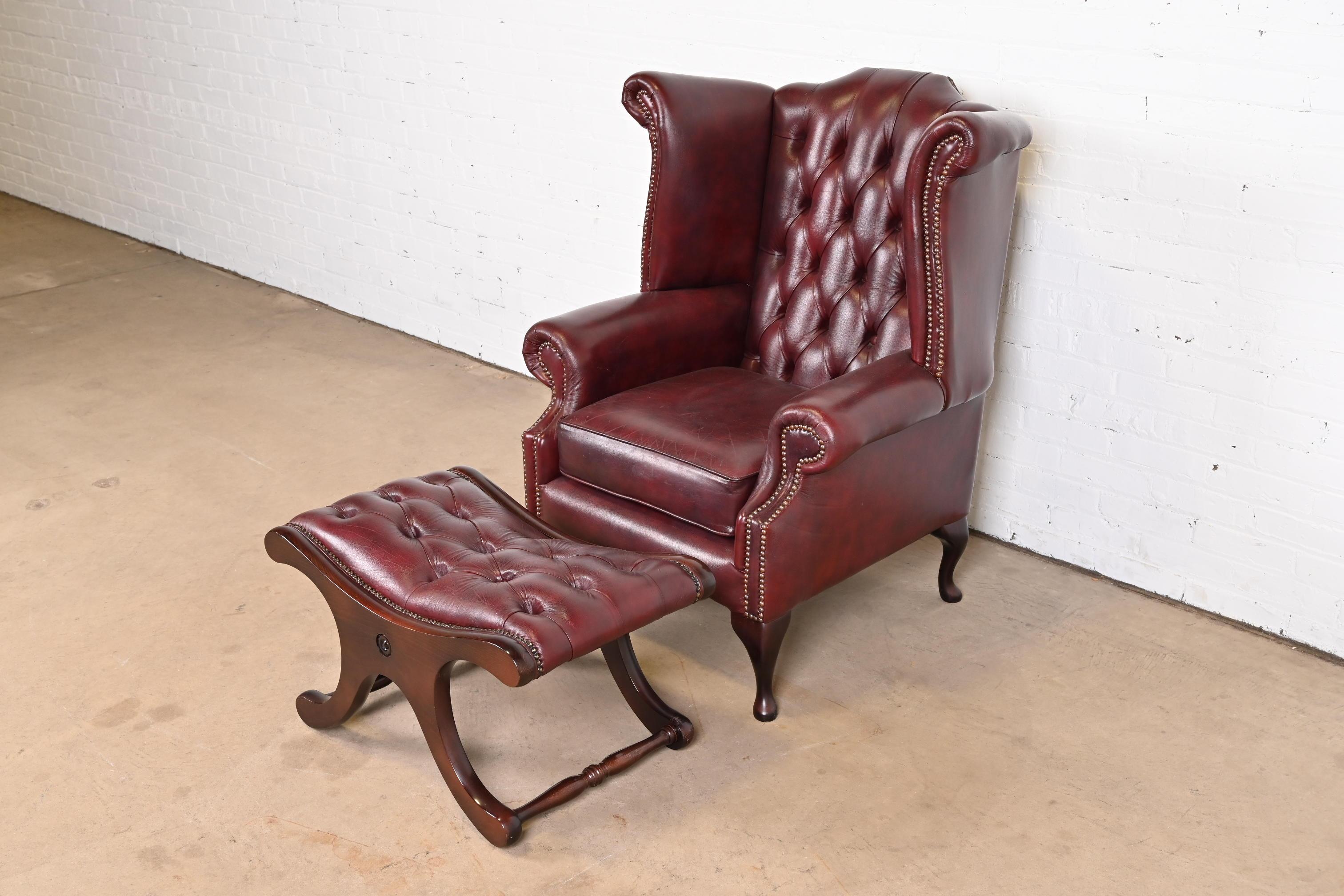 20th Century Vintage English Oxblood Leather Chesterfield Wingback Lounge Chair with Ottoman
