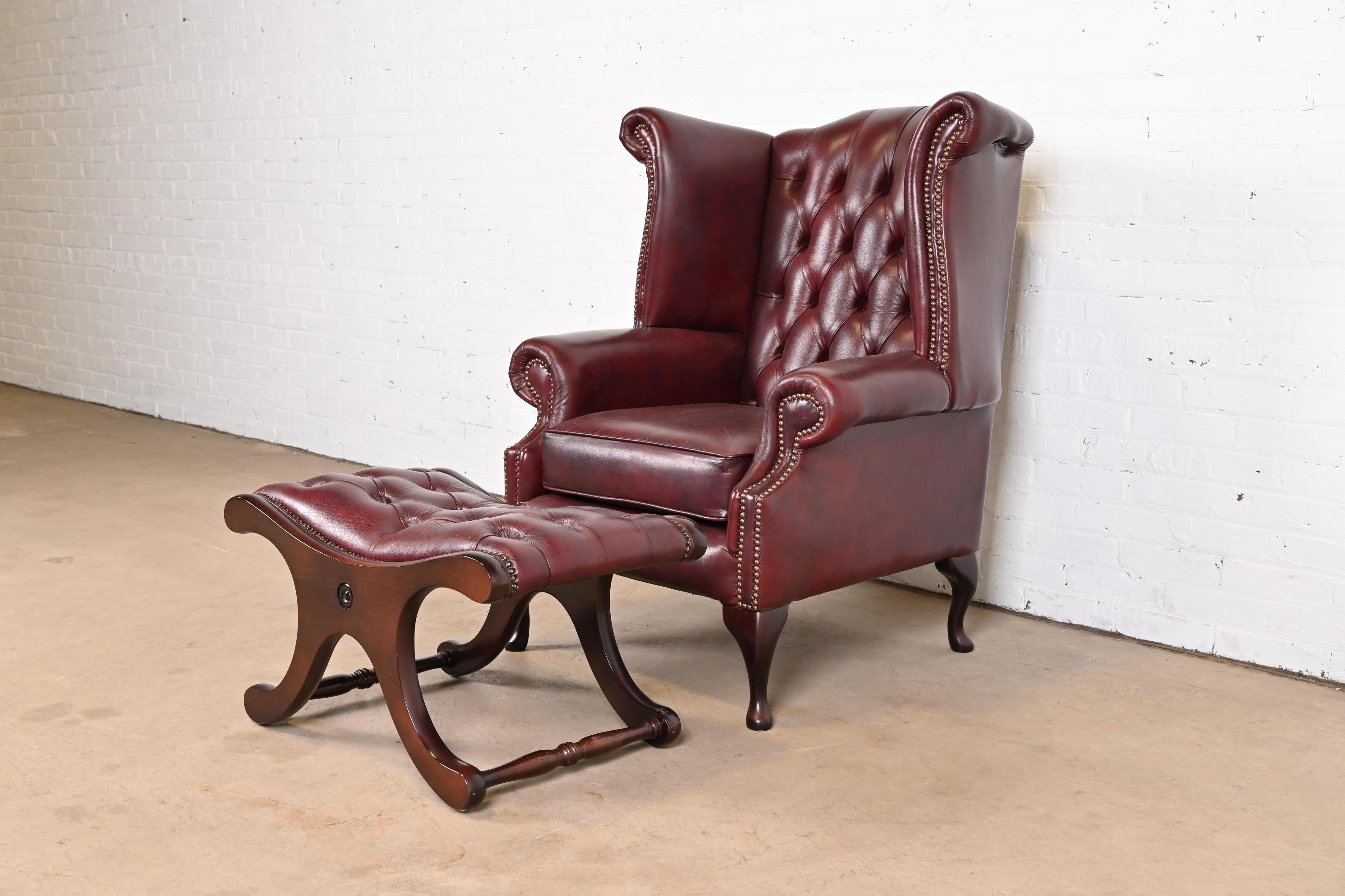 Brass Vintage English Oxblood Leather Chesterfield Wingback Lounge Chair with Ottoman