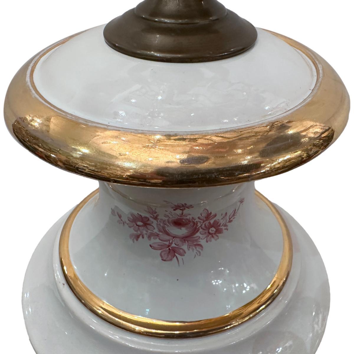 A large circa 1940's English porcelain lamp with landscape and gilt decoration.

Measurements:
Height of body: 22
