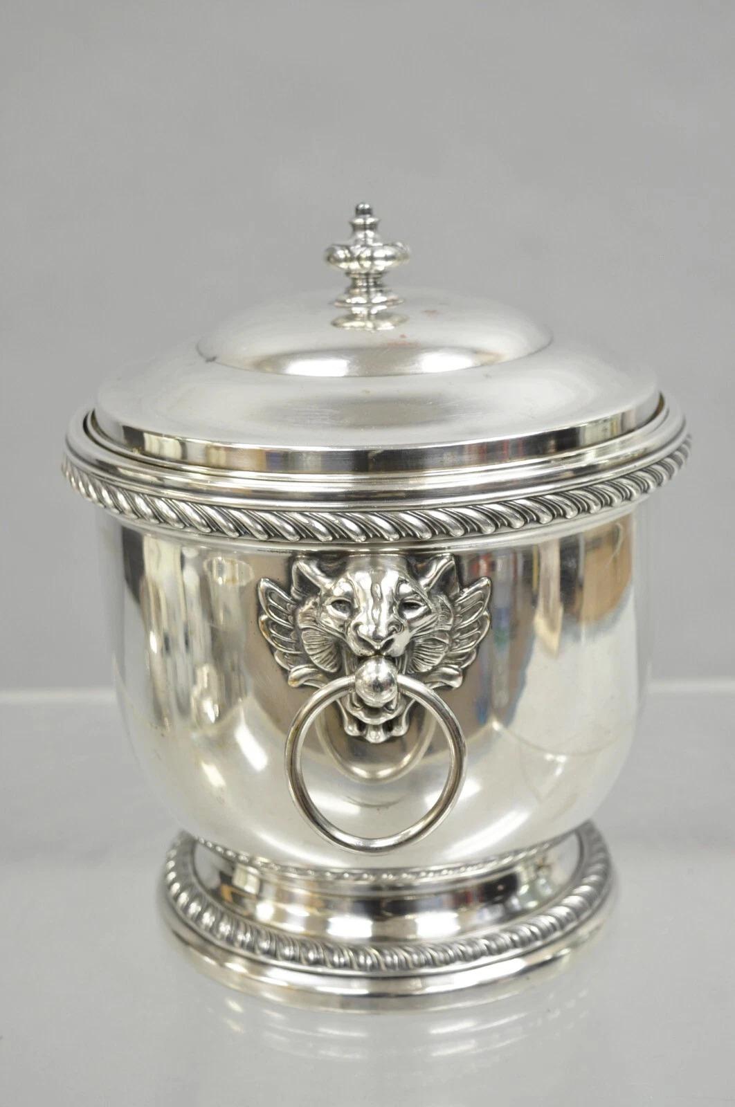 Vintage English Regency Silver Plated Lion Head Lidded Ice Bucket With Glass Lined Interior by Poole. Circa Mid 20th Century. Measurements: 9