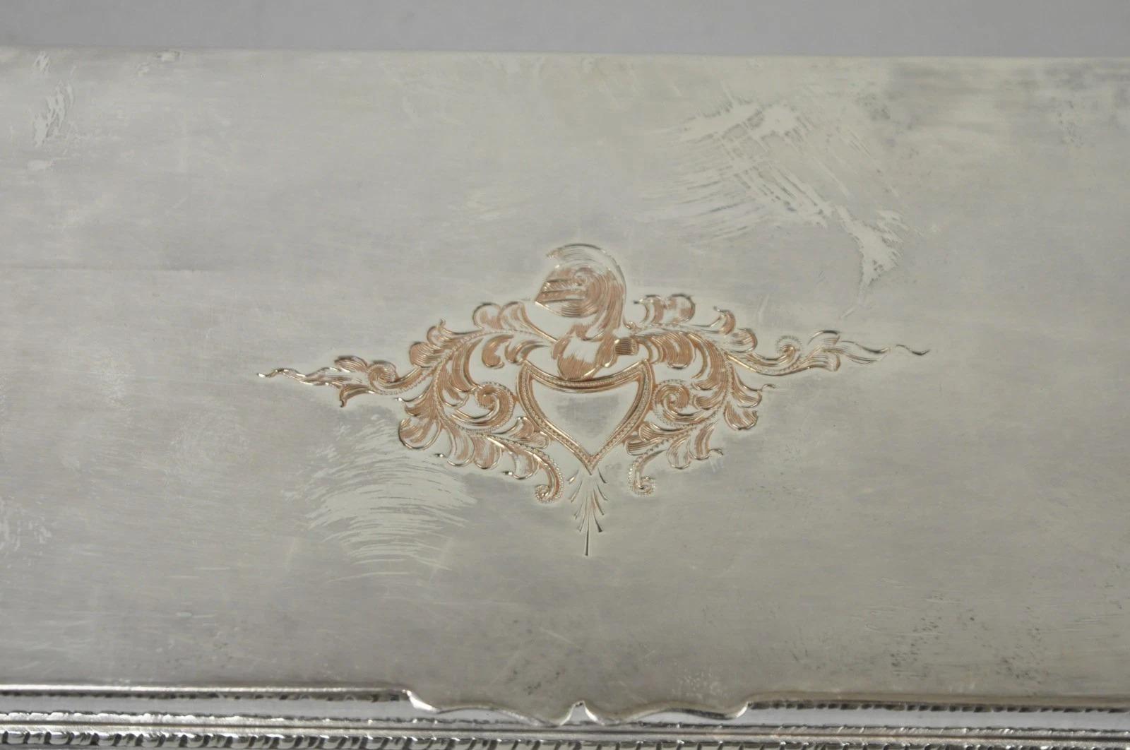 Vintage English Regency Silver Plated Narrow Vanity Dresser Jewelry Boxes with Engraved Shield/Soldier Crest Motif and 4 Interior Compartments - a Pair. Circa Mid 20th Century. Dimensions : 1