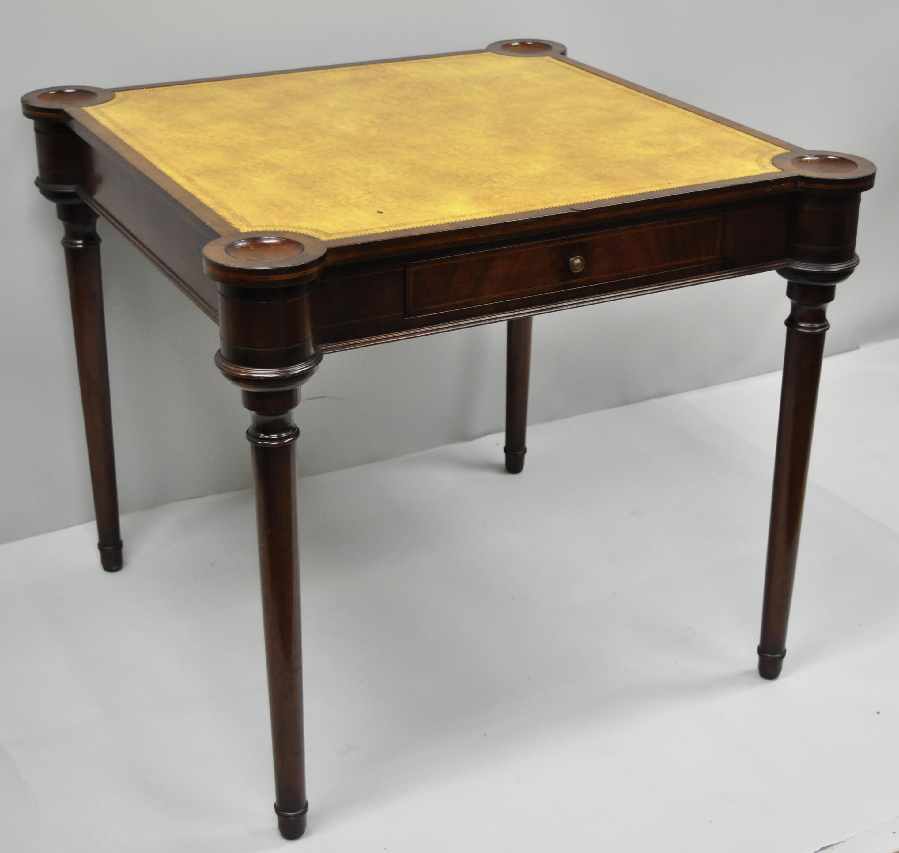 Regency style yellow leather top game table. Item features one dovetailed drawer, yellow tooled leather top, tapered legs, Classic Regency form, circa mid-20th century. Measurements: 28.5