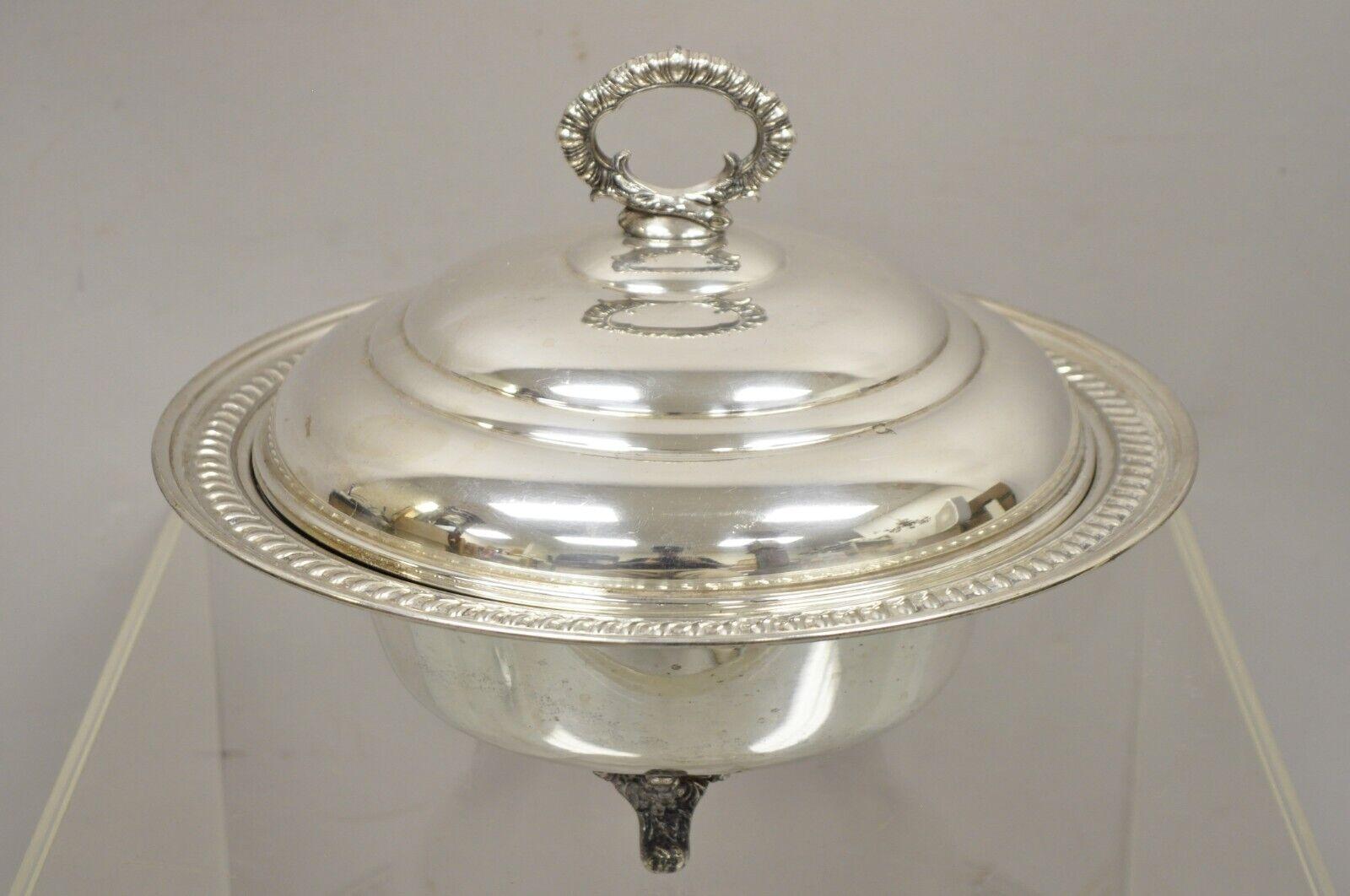 Vintage English Regency Victorian style silver plated lidded vegetable serving dish bowl. Item features Etch decorated interior, dome lid, triple raised feet. Circa early-mid-1900s. Measurements: 9