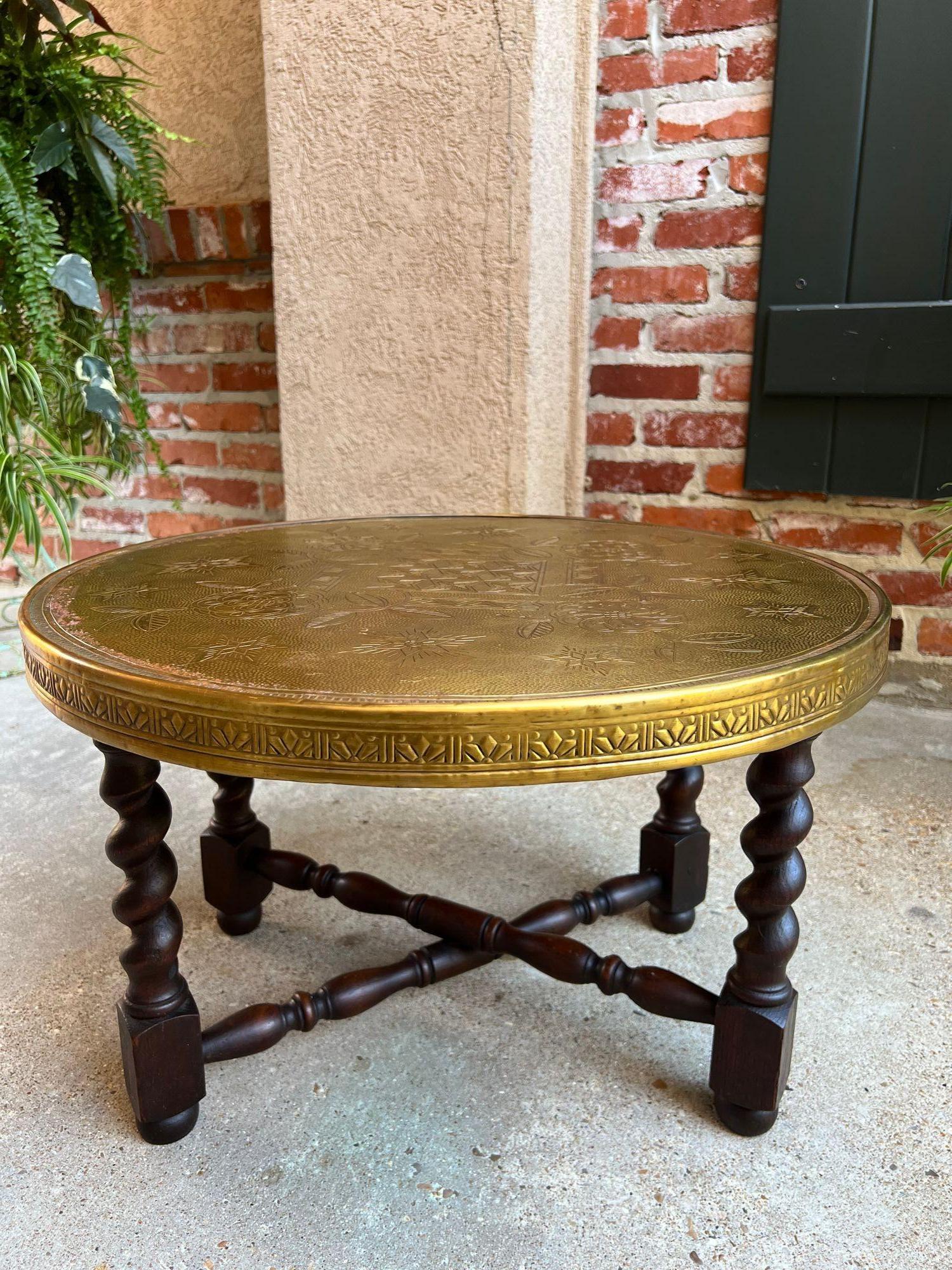 Vintage English Round Brass Coffee Tea Wine Table with Folding Barley Twist Base.
 
Direct from English, a versatile FOLDING TABLE, great as a coffee table or end table, and perfect as an accent piece. Round brass table top has etched design