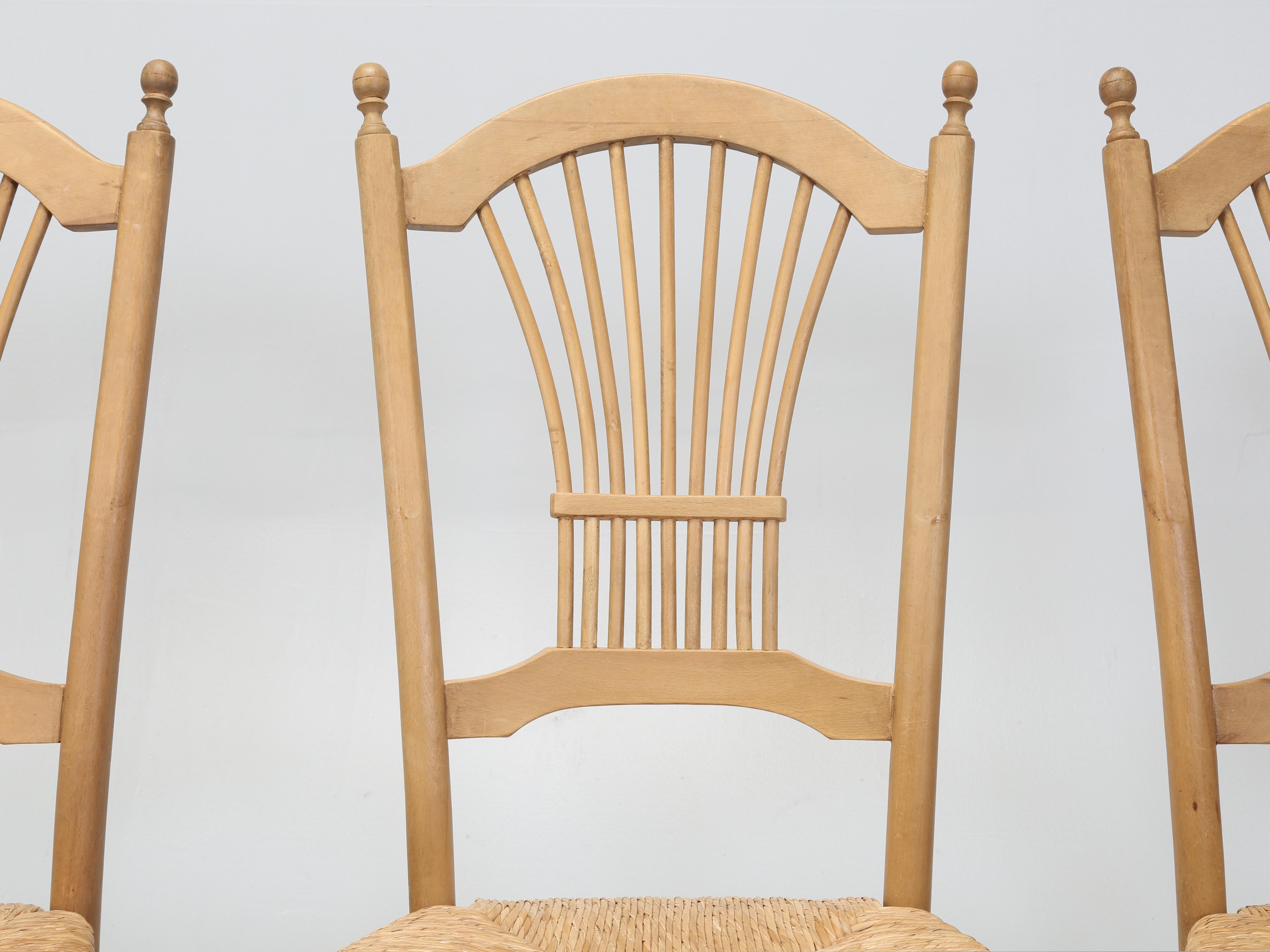 Set of (6) Country English Dining Chairs with Rush Seats that are unusually comfortable. There are (4) side chairs and a pair of Arm Chairs, plus there is a matching Country English Pine Farm Table being offered on 1stdibs as well. The set of (6)