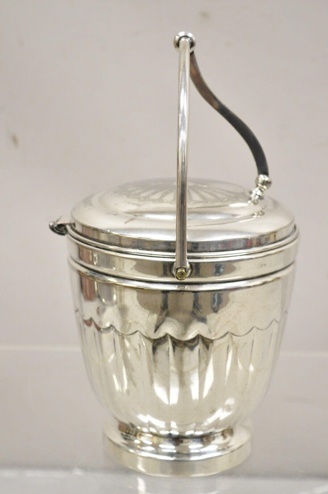 Vintage English Sheridan Silver Plated Reticulated Hinge Lid Ice Bucket. Item features glass lined interior original hallmark..
Circa Mid to late 20th Century. Measurements: 13