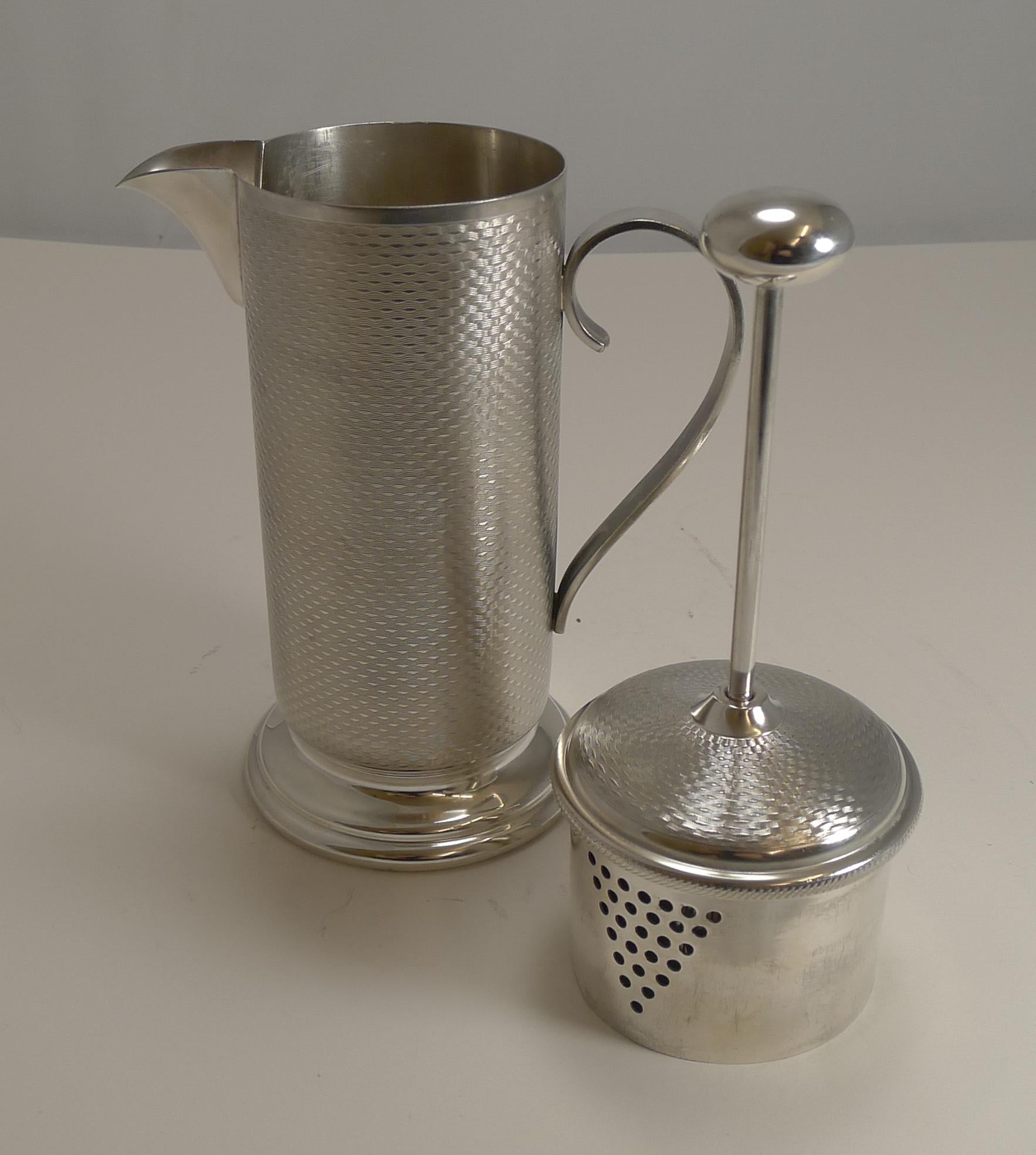 A wonderful and most unusual cocktail mixer, less of a shaker and looking rather like a coffee pot or cafetiere.

Made by the well renowned silversmith, James Dixon and Sons and fully marked on the underside. Marked Made in England and 1 pint. The