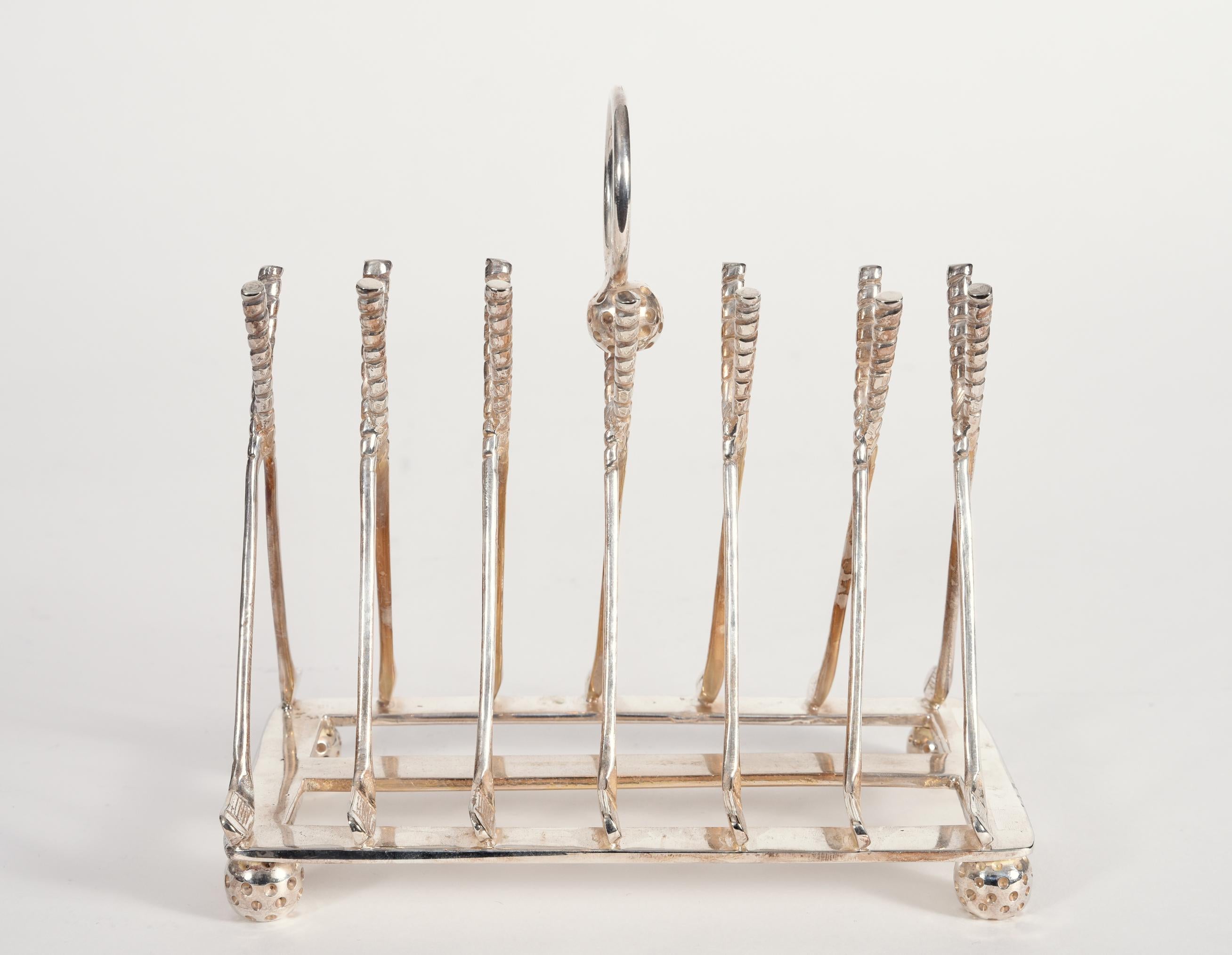Vintage English silver plated or copper golf sport design details tableware toast rack. The piece is excellent condition, maker's mark undersigned. The toast rack measure about 6.5 inches length x 4 inches width x 6 inches high.