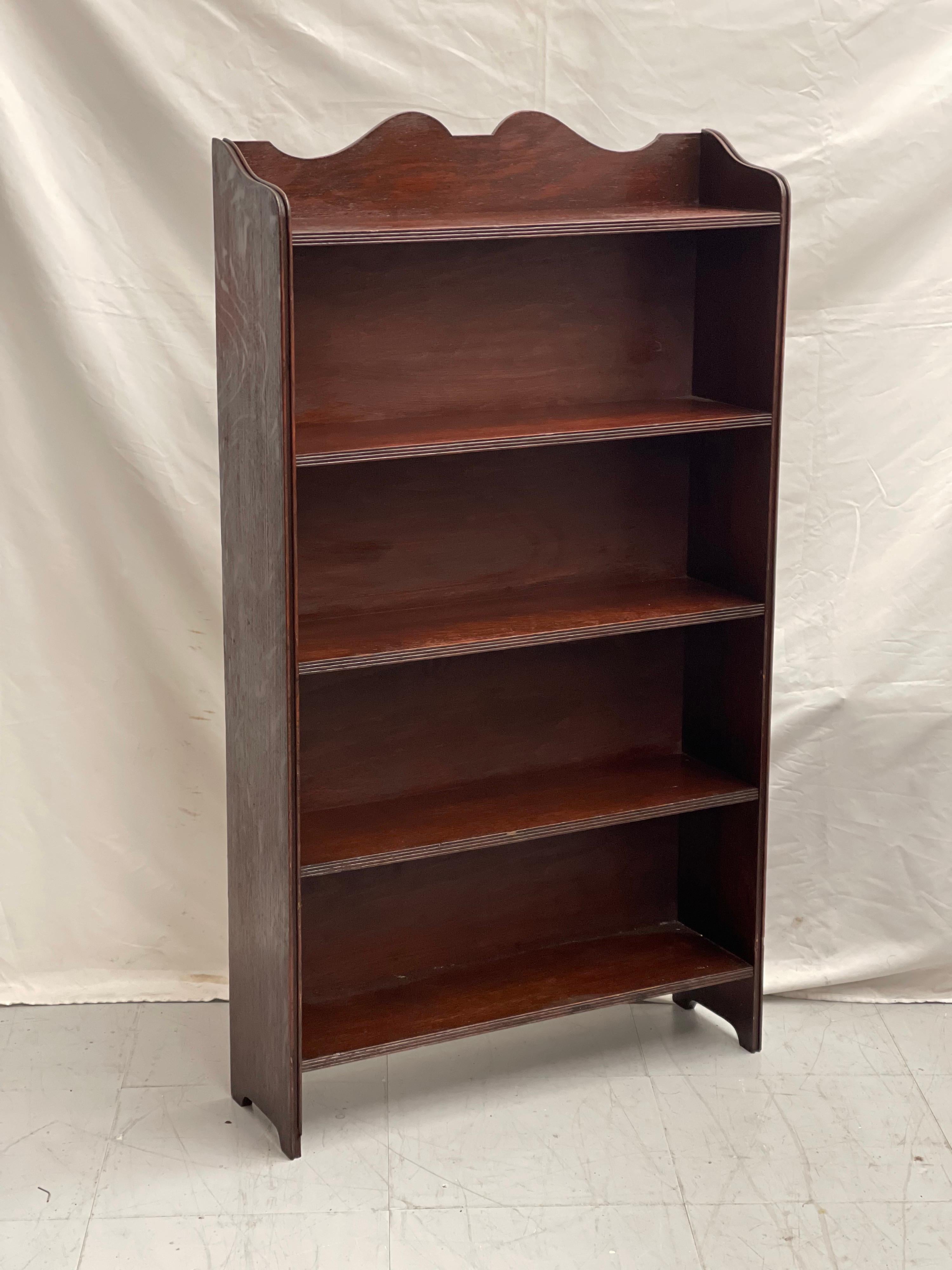 Vintage Solid Mahogany bookcase features Crown style cutouts on each side and curved crest. Perfect for a reading nook or a small space or as a Display Cabinet.

Shelf Height 8 inches
Shelf Depth 6.5 inches