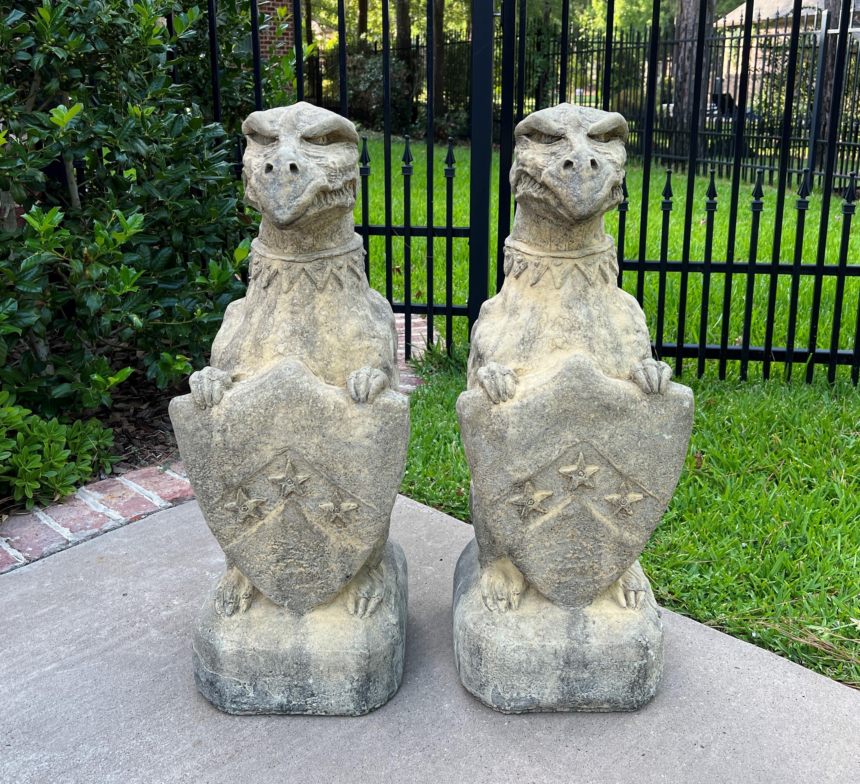Vintage pair English cast stone Gargoyles Griffins with heraldic shields statues~~garden figures~~statuary~~Architectural Yard Decor

Original aged patina.

 The perfect accent piece or focal point in an entryway, garden, yard, flower bed, or