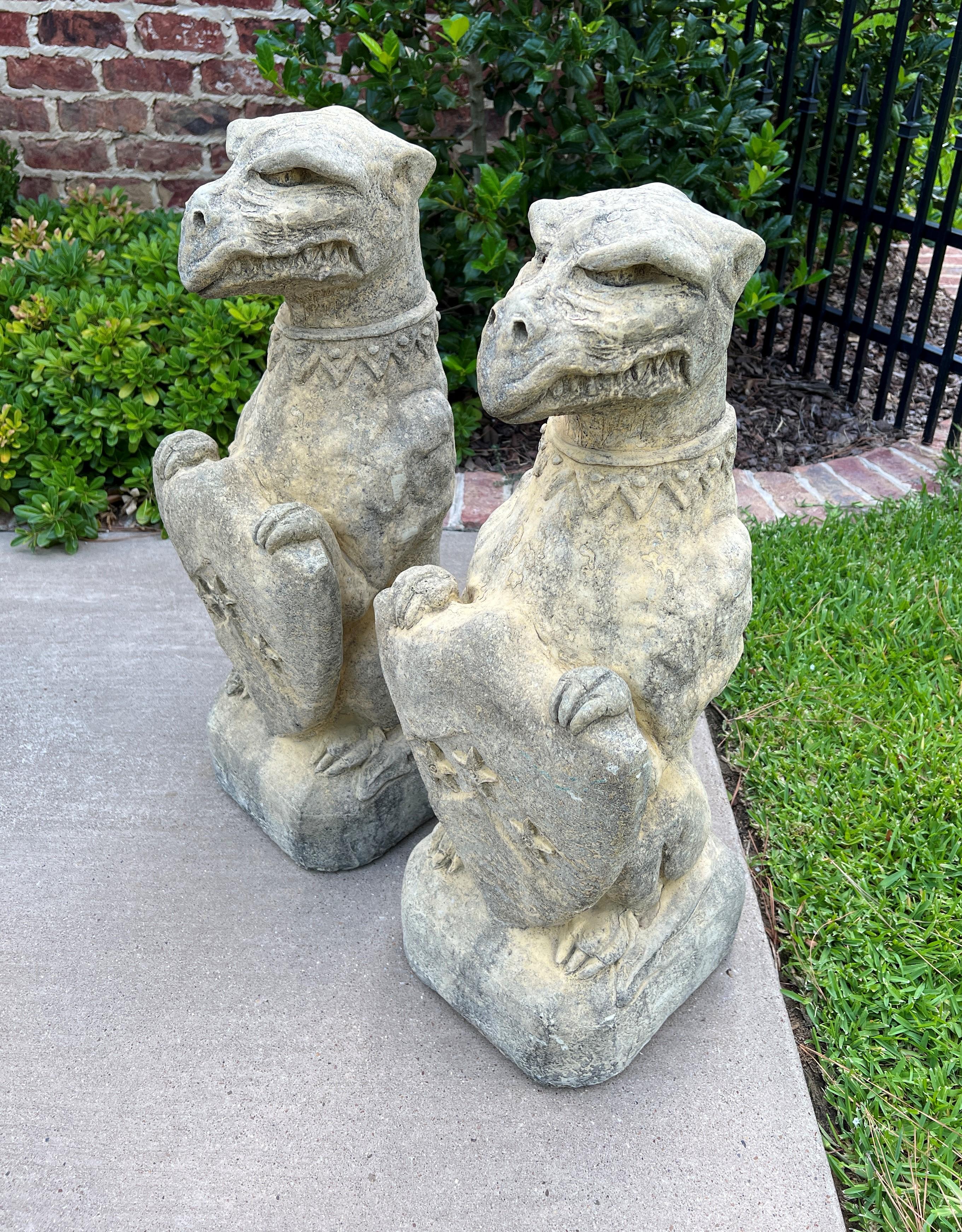 20th Century Vintage English Statues Garden Figures Gargoyles Shield Cast Stone Pair