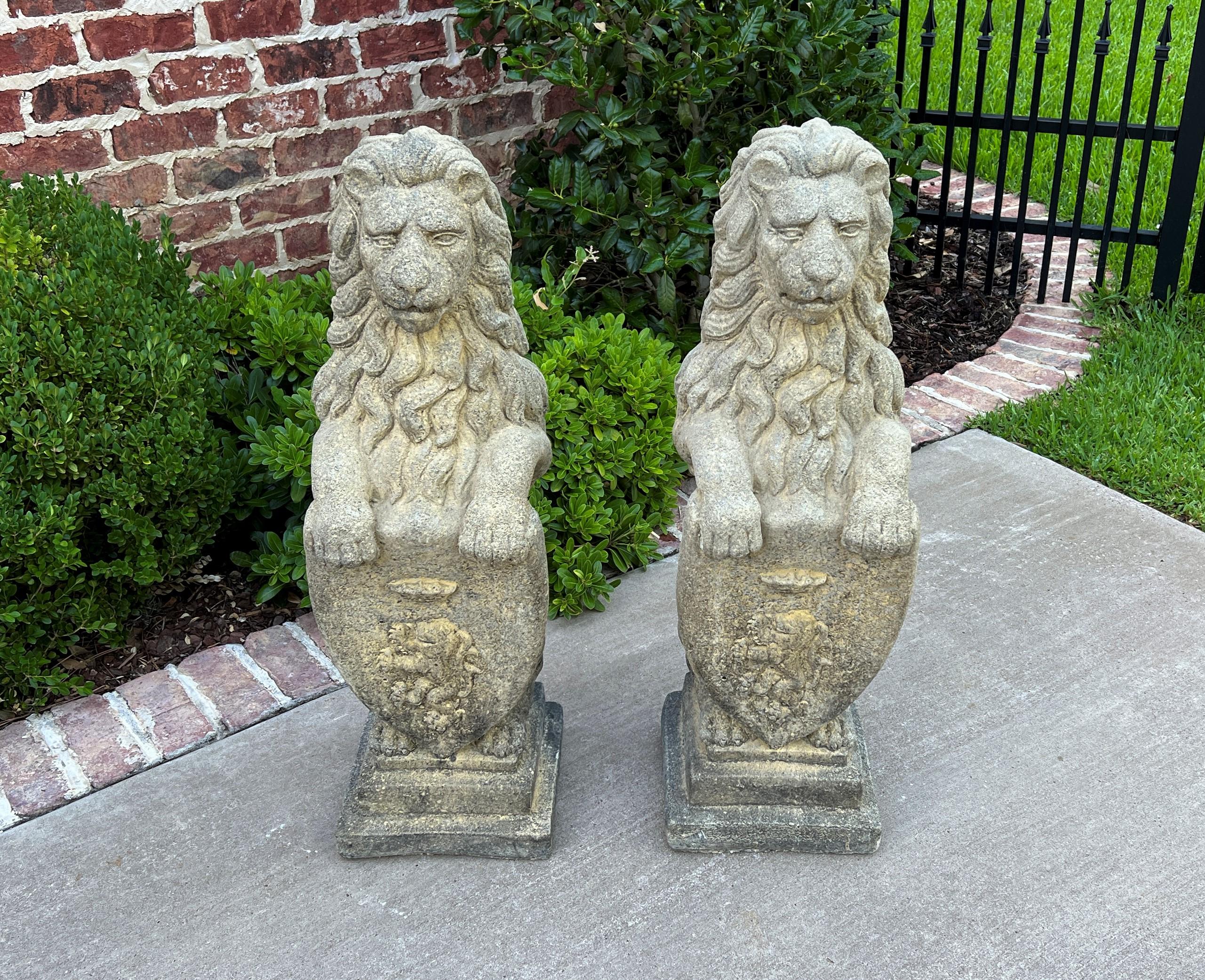 Vintage pair English cast stone lions with heraldic shield statues~~garden figures~~statuary~~architectural yard decor

Original aged patina

 The perfect accent piece or focal point in an entryway, garden, yard, flower bed, or sunroom 

 Each