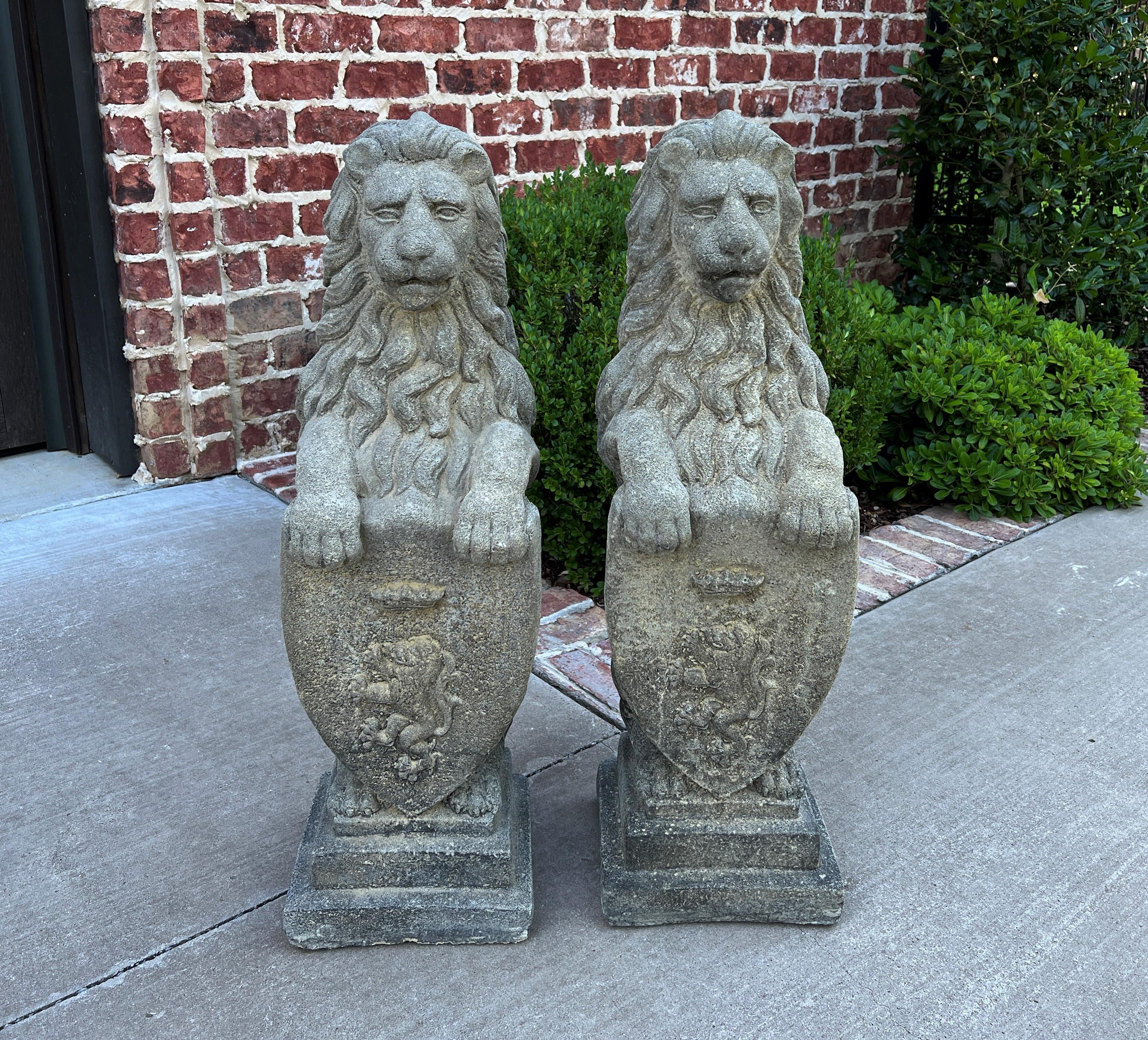 Vintage pair English cast stone lions with Heraldic shield statues~~Garden Figures~~Statuary~~Architectural Yard Decor

Original aged patina

 The perfect accent piece or focal point in an entryway, garden, yard, flower bed, or sunroom 

 Each