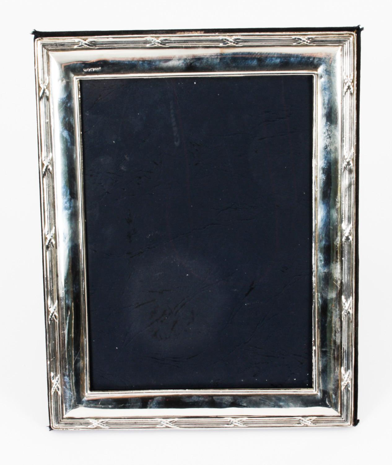 A truly superb Vintage sterling silver photo frame with hallmarks and the makers mark of Carrs of Sheffield and dated 1993.

The beautiful rectangular photo frame is double reeded border with anthemion to each corner.
 
An excellent gift idea