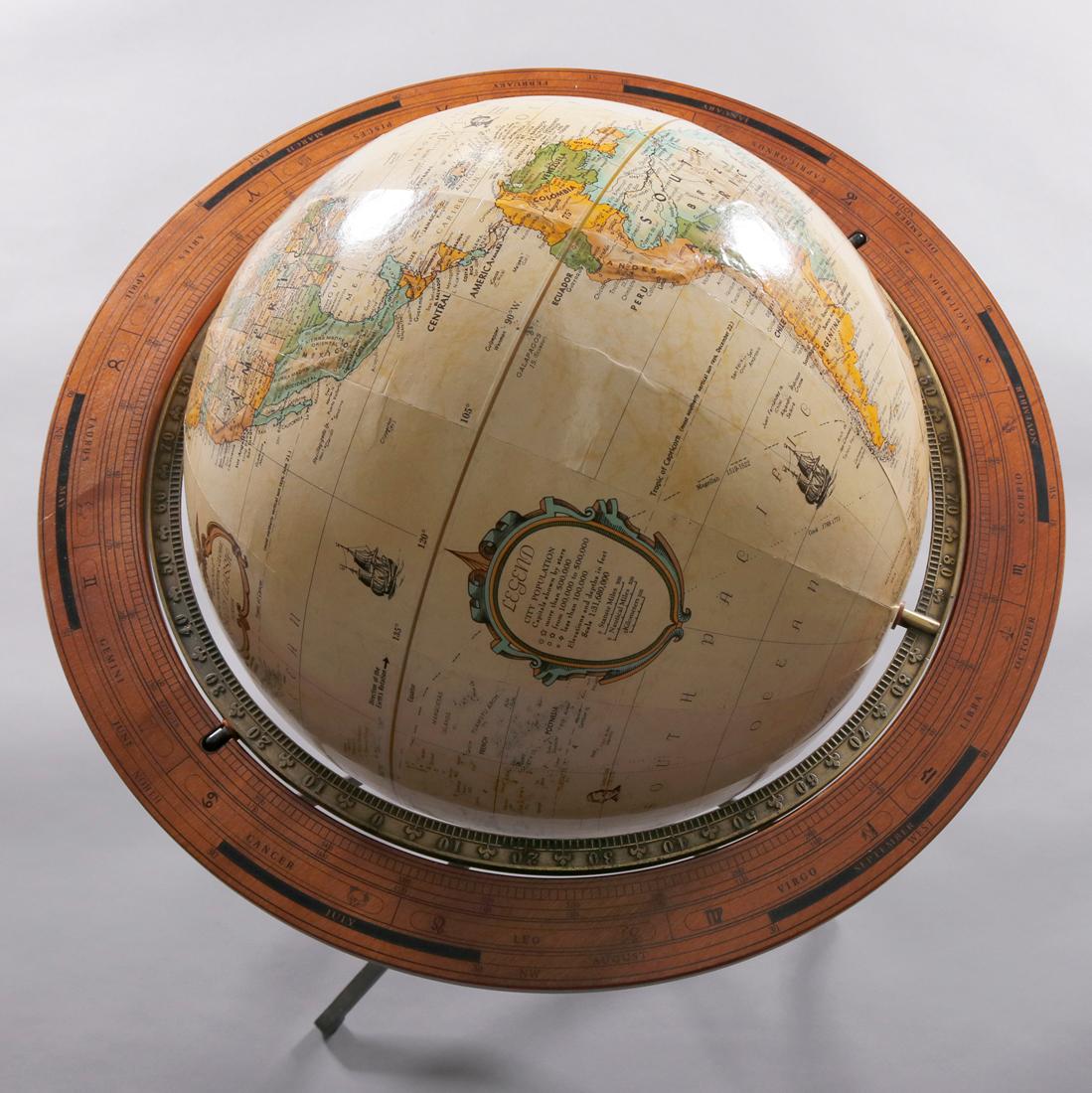A vintage English style Old World Globe on cast metal tripod stand having wood frame, 20th Century

Measures: 40