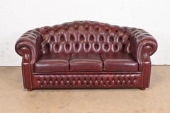 Vintage English Tufted Oxblood Leather Camelback Chesterfield Sofa