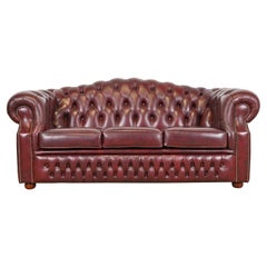 Vintage English Tufted Oxblood Leather Camelback Chesterfield Sofa