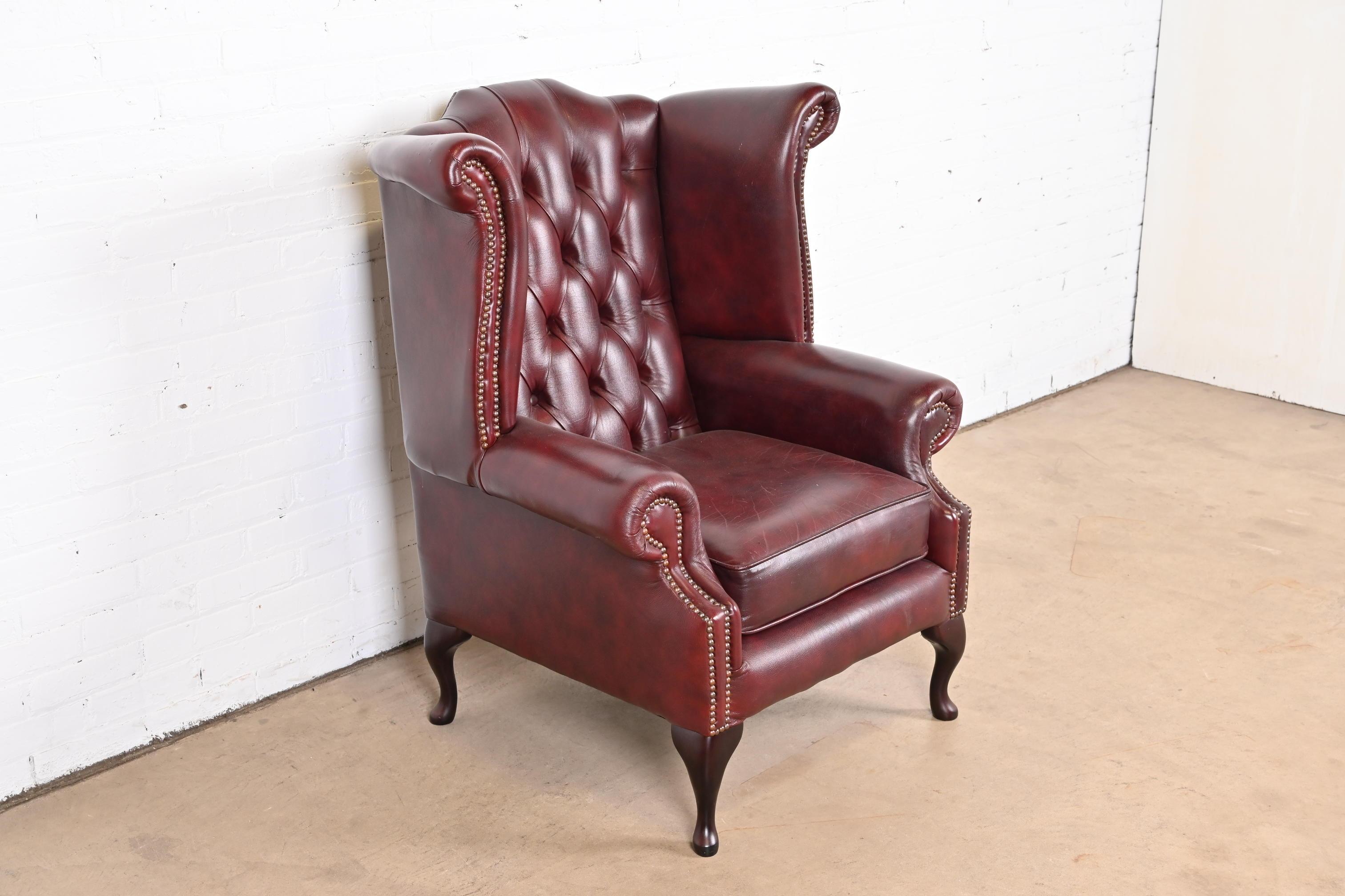 Vintage English Tufted Oxblood Leather Chesterfield Wingback Lounge Chair In Good Condition In South Bend, IN