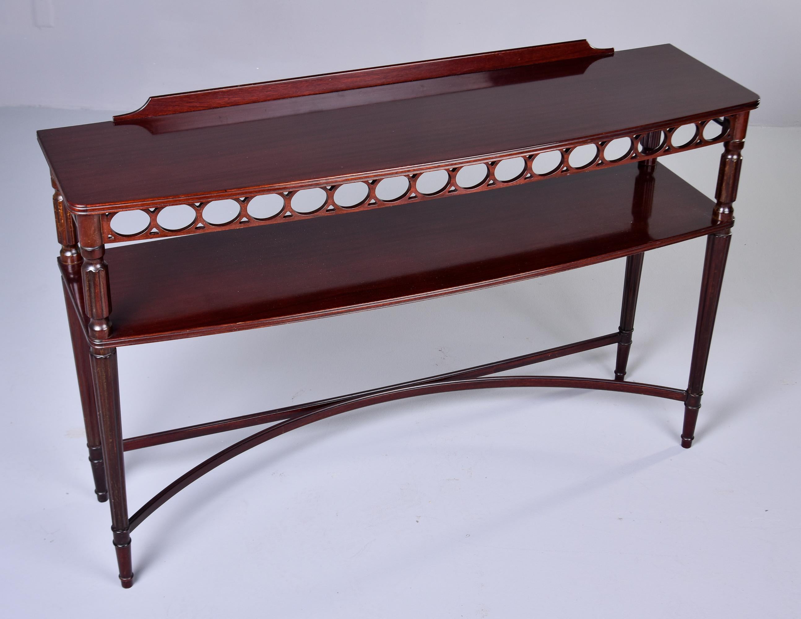 20th Century Vintage English Two Tier Mahogany Console with Open Work Apron For Sale