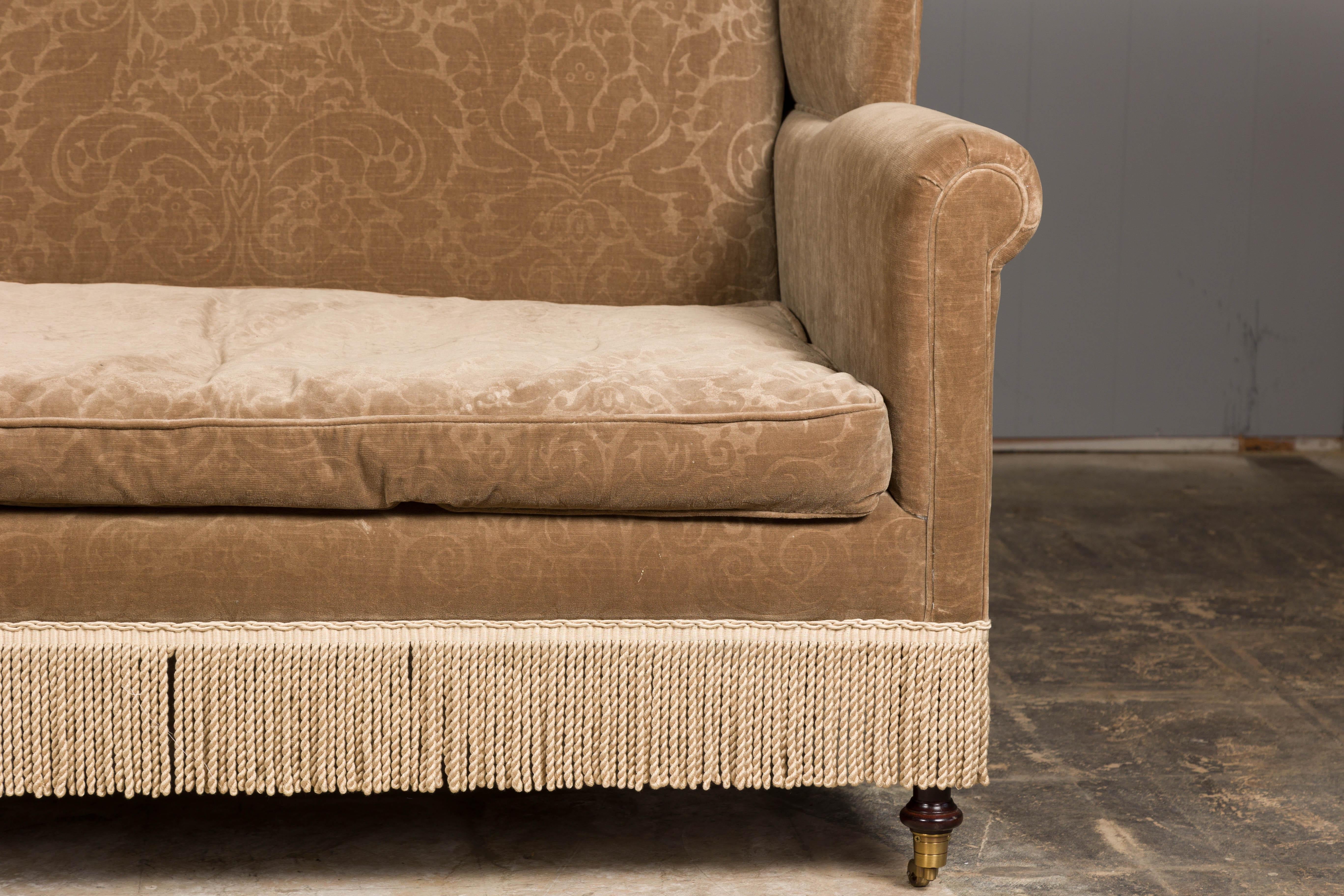 20th Century Vintage English Upholstered Loveseat with Out-Scrolling Arms and Casters For Sale