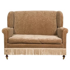 Vintage English Upholstered Loveseat with Out-Scrolling Arms and Casters