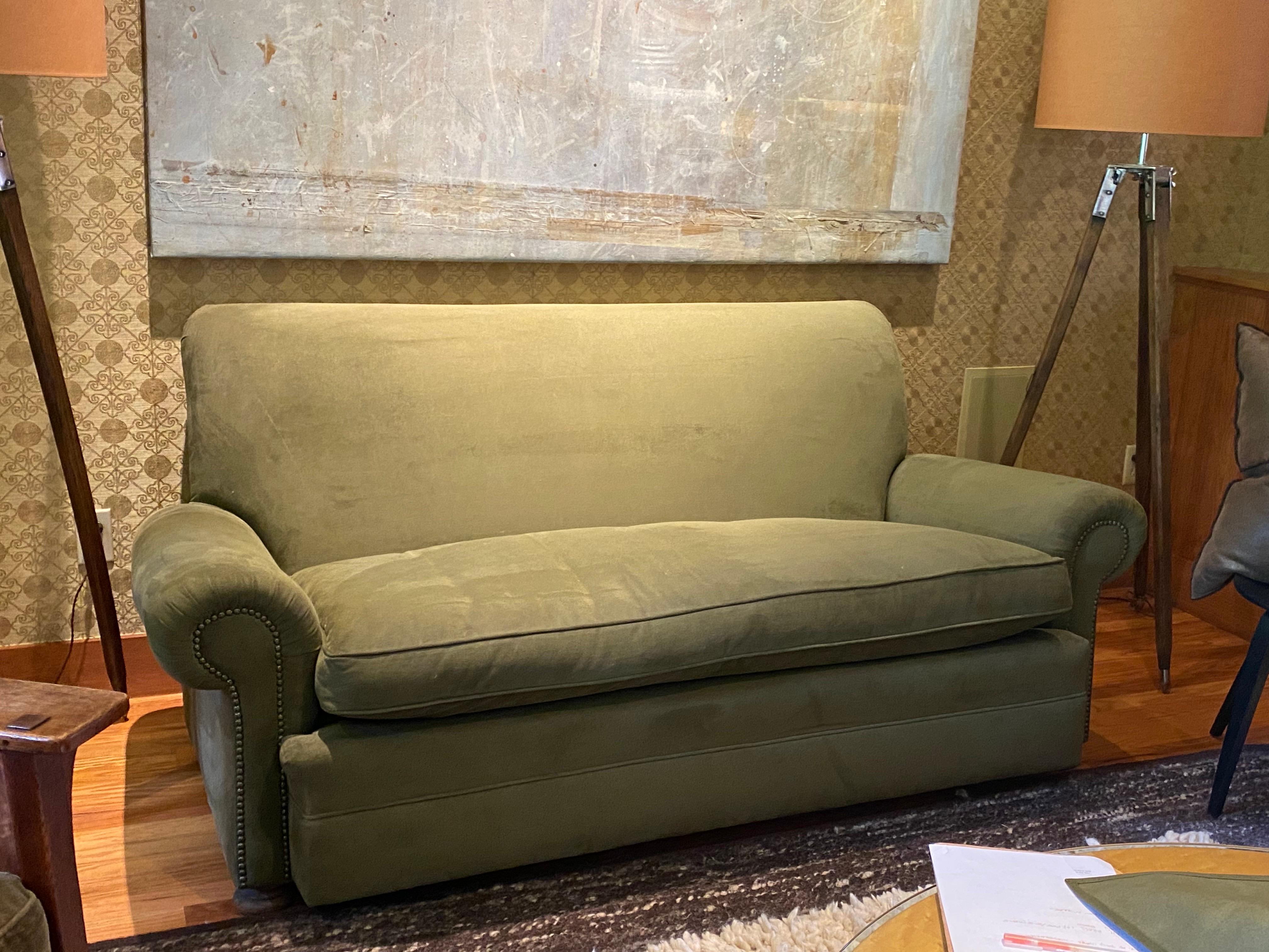 Vintage English Upholstered Roll Arm Sofa in Green Ultra Suede
Upholstered in olive green ultrasuede, likely dating to the late 20th. Crafted with a sturdy frame, it features a soft, ultra-suede upholstery in a muted olive green. The sofa's design