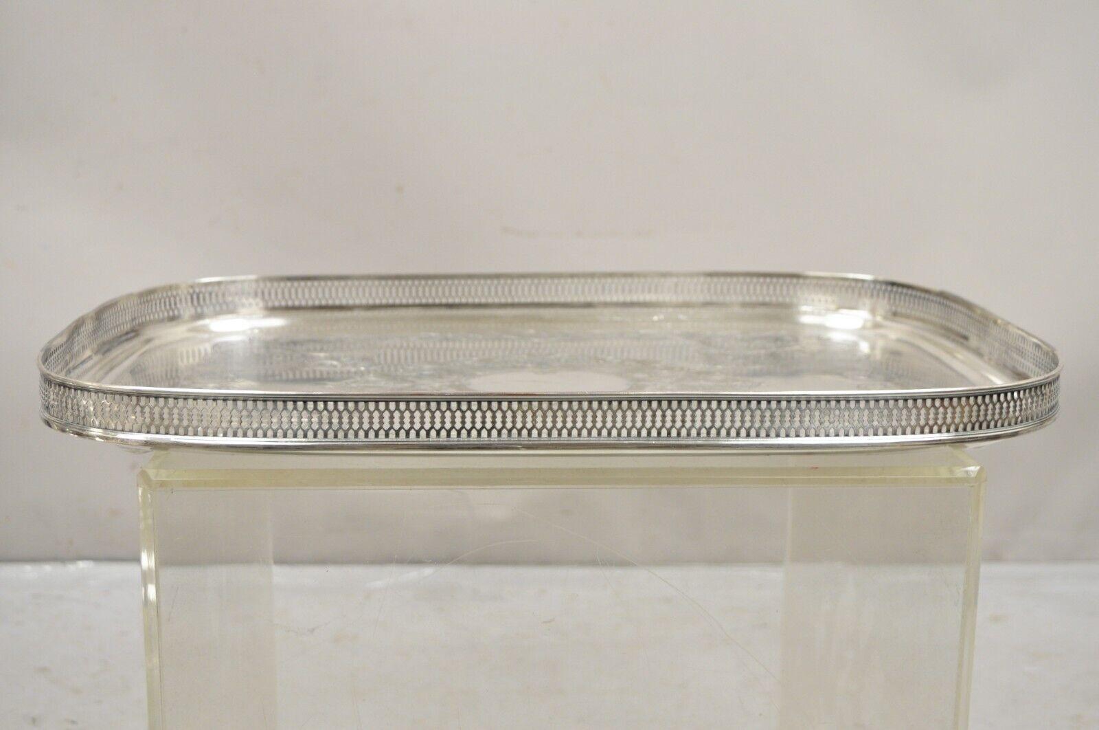 Vintage English Victorian LBS CO Superfine Silver Plated Tray with Gallery. Item features raised pierced gallery, scrolling etch work center, original hallmark, very nice vintage item. Circa Mid 20th Century. Measurements:  1.5