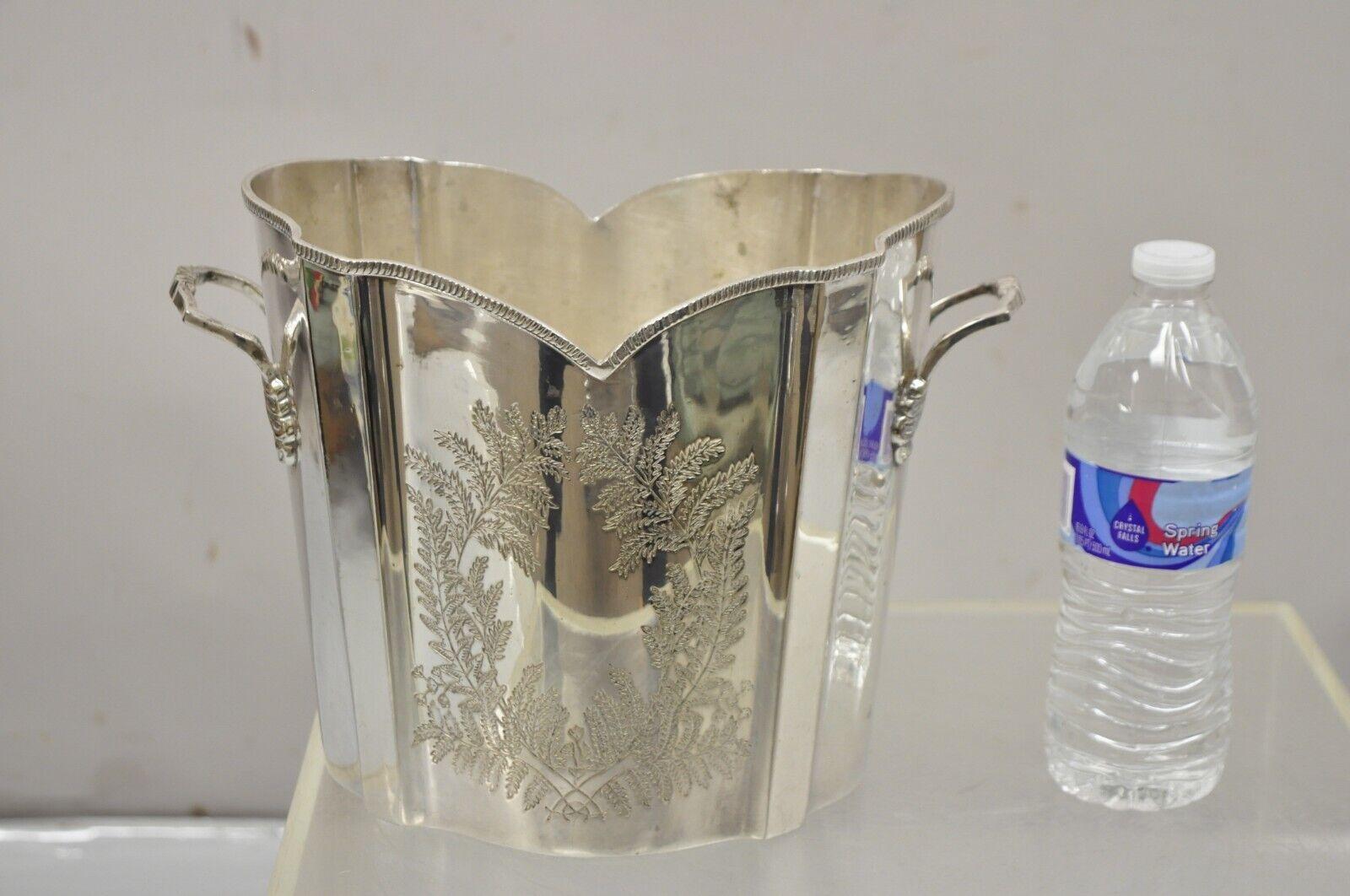 Vintage English Victorian Silver Plated Fluted Champagne Chiller Ice Bucket. Item features Etched wreath design to both sides, twin handles, shapely fluted form, very nice vintage. Circa Early to mid 20th Century. Measurements:  8.5