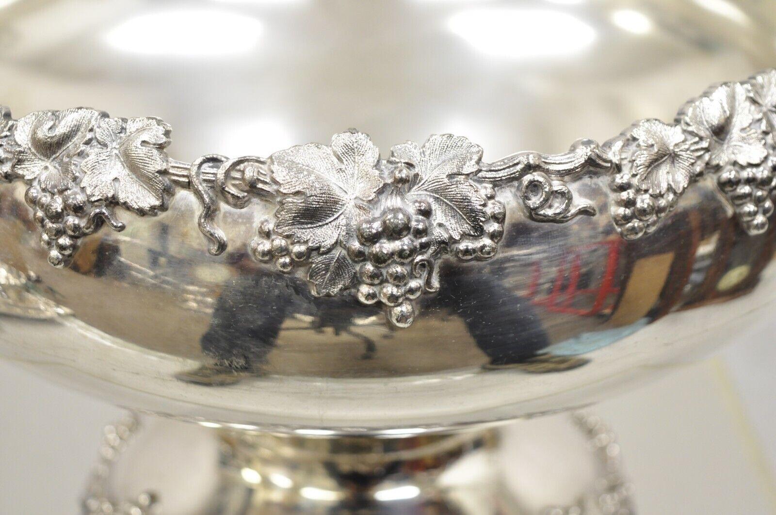 Vintage English Victorian Silver Plated Grapevine Pedestal Base Punch Bowl. Item features a unique grapevine and maple leaf pedestal base, shapely fluted form, original hallmark, very nice antique item. Circa  Early to Mid 20th Century.