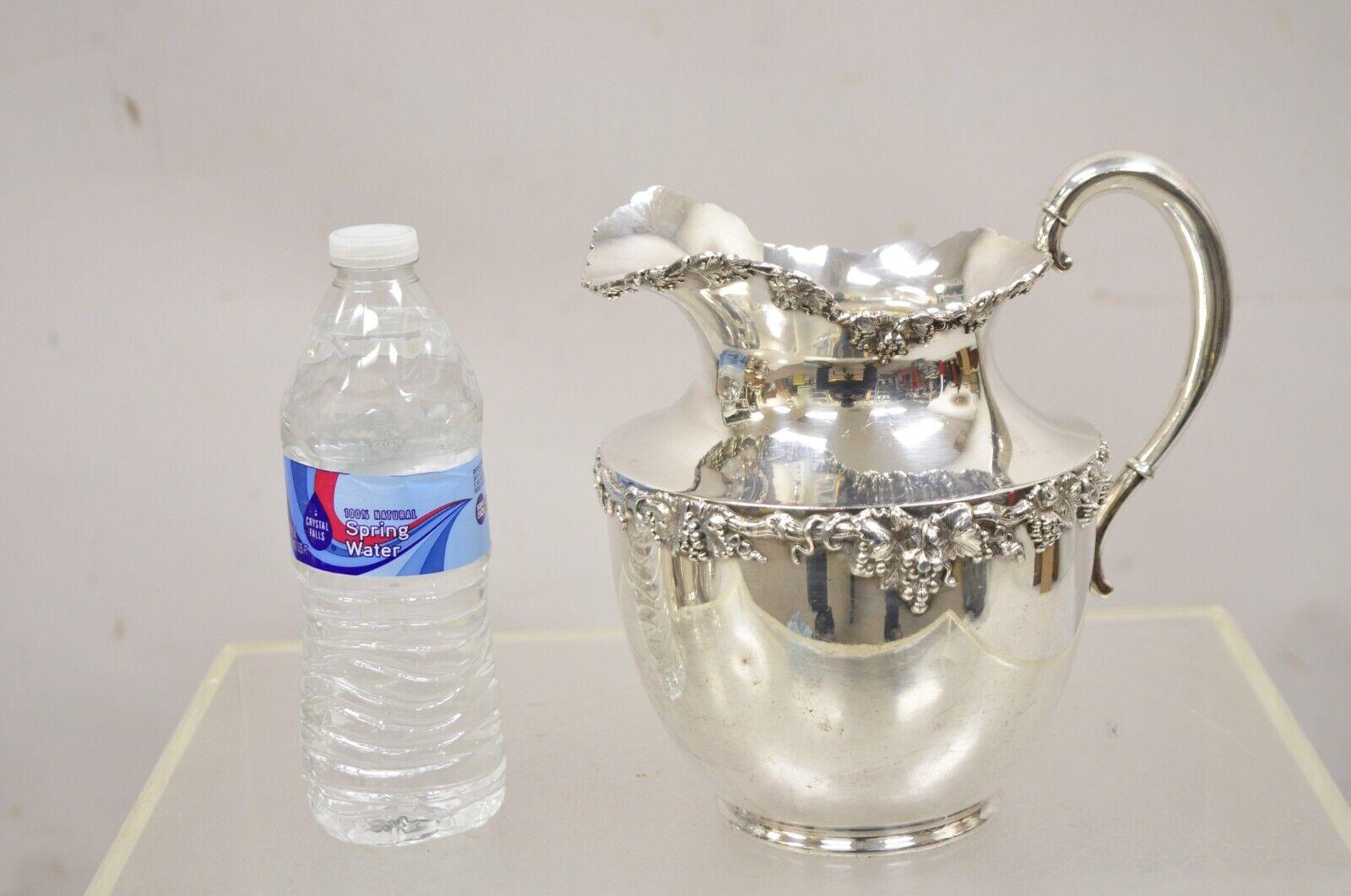 Vintage English Victorian Style Silver Plated Grapevine Pattern Water Pitcher. Circa Mid 20th Century. Measurements: 8.5 