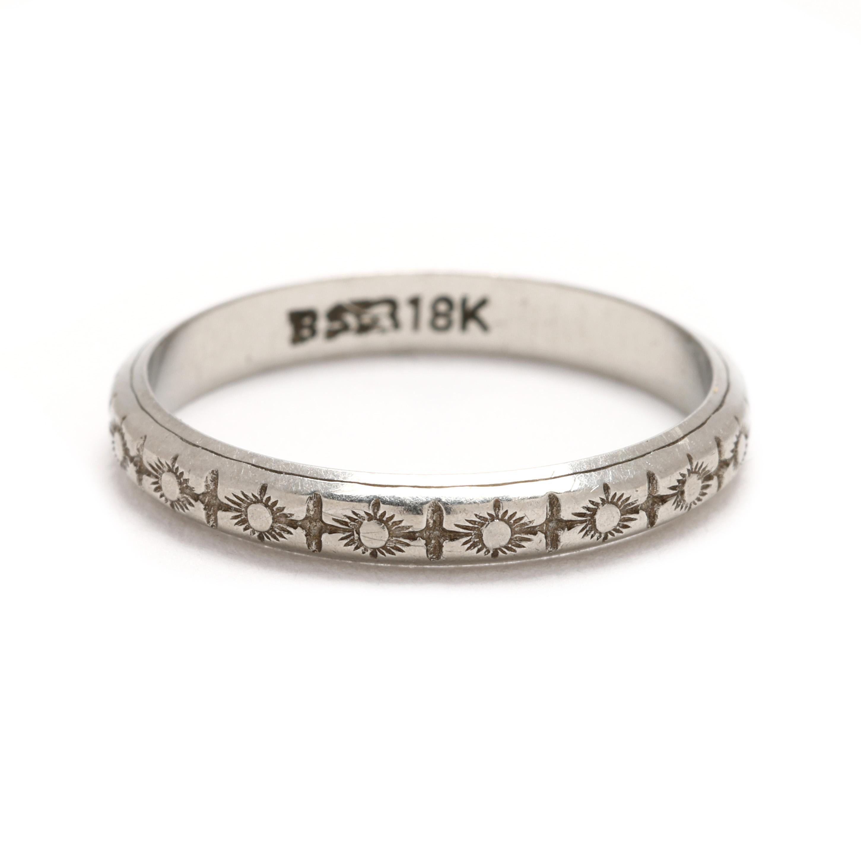Add a touch of vintage charm to your collection with this stunning engraved band ring, crafted in luxurious 18k white gold. This size 5.5 ring features intricate, hand-engraved detailing, showcasing exceptional craftsmanship and timeless elegance.