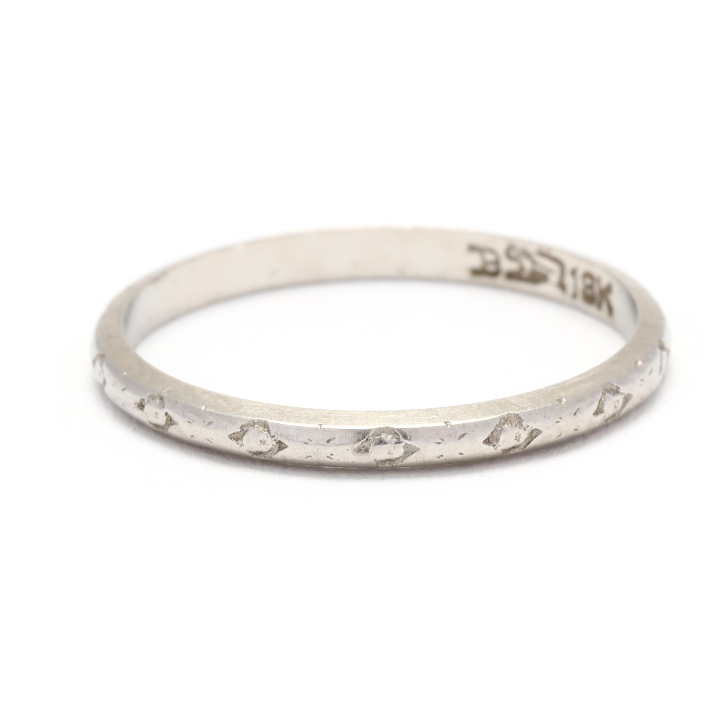 This Vintage Engraved Wedding Band is a beautiful and timeless choice for your special day. Made with 18K white gold, this ring is durable and lustrous. It features delicate and intricate engravings, adding a romantic and vintage-inspired touch to