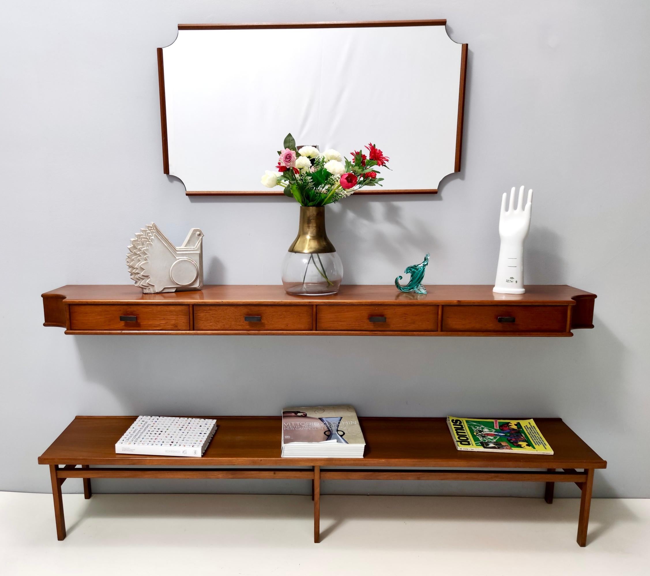 Made in Italy, 1959.
The console table are made in walnut. 
The design of the corners of the mirror recalls that of the corners of the console, to give a pleasing and coherent look to the whole set. 
This set is in the style of Ico Parisi.
Cushions