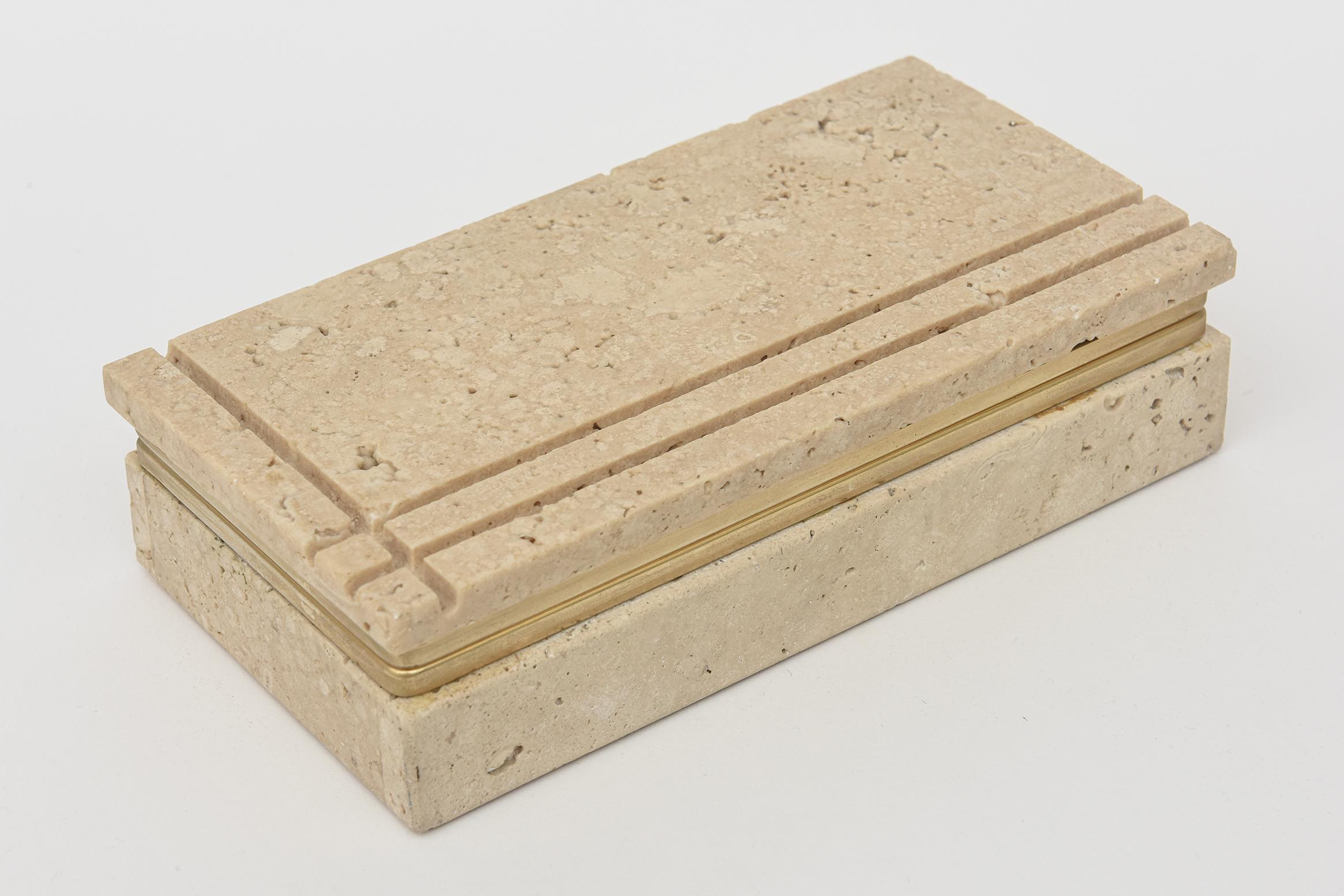 This vintage Italian travertine and brass hinged box is by the architect Enzo Mari. Great desk accessory and cocktail table addition. Very well made. From the 70's.