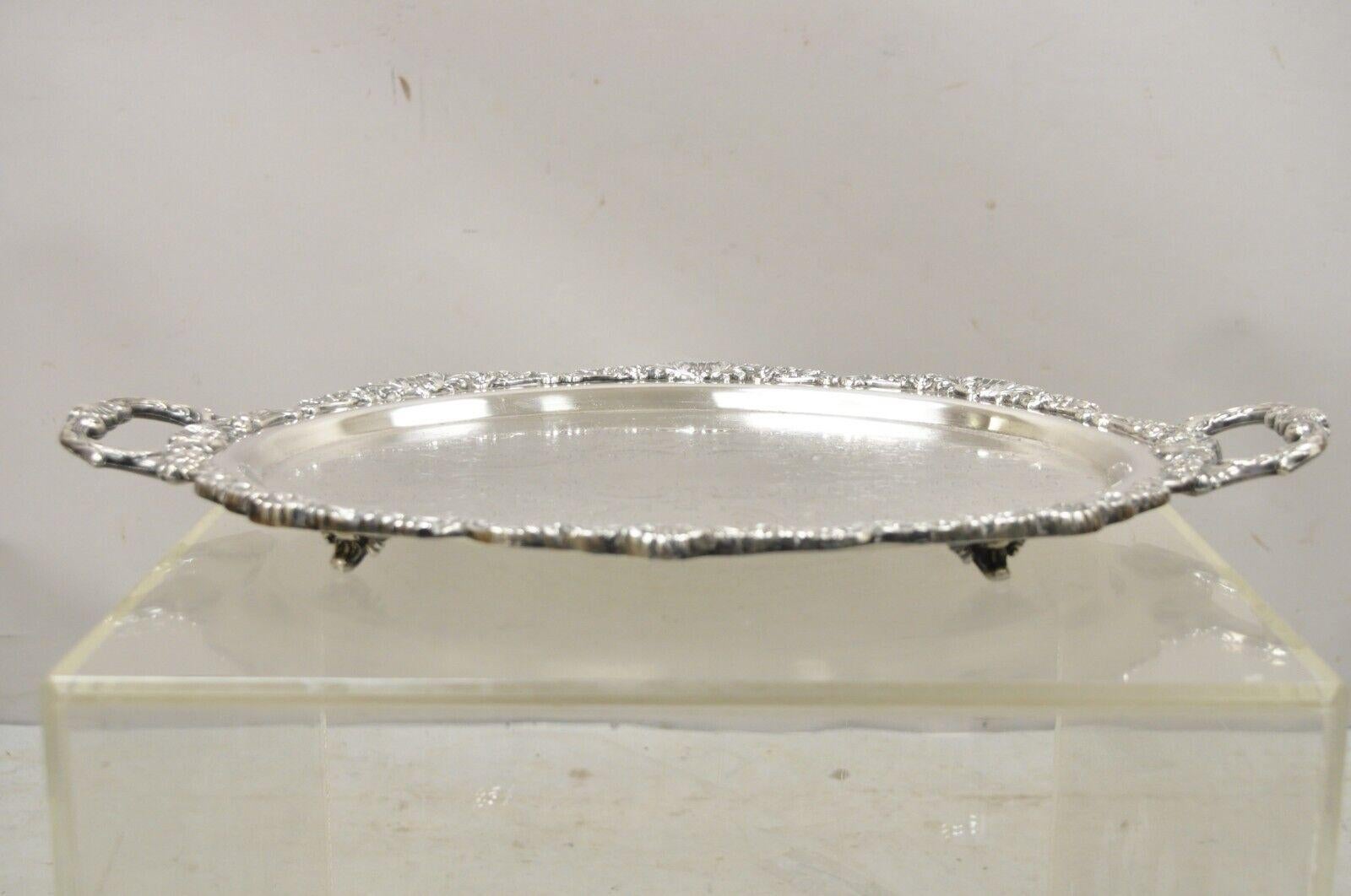 Vintage EPCA Bristol silverplate by Poole Silver plated oval platter tray. Item features raised on feet, ornate twin handles, oval form, original stamp, very nice vintage item, great style and form. circa Early to Mid-20th century. Measurements: 2
