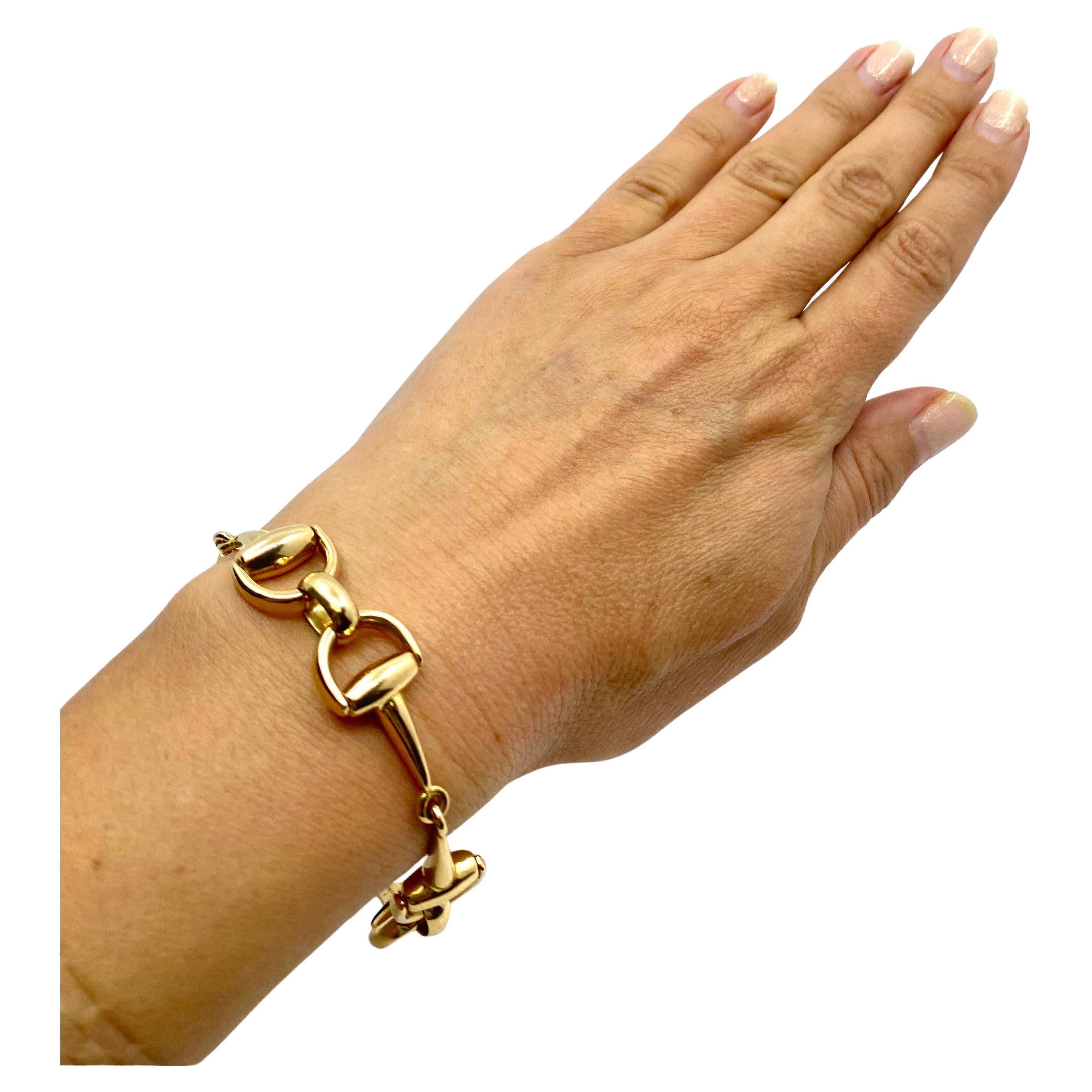 
CIRCA: 1990’s
MATERIALS: 18k Yellow Gold
WEIGHT: 32.2 grams
MEASUREMENTS: 7 1/2” x 1/2”
HALLMARKS:  750

ITEM DETAILS:
A beautiful vintage bracelet with equestrian motif, made in 18k gold. The links of the bracelet are designed as pair of stirrups.