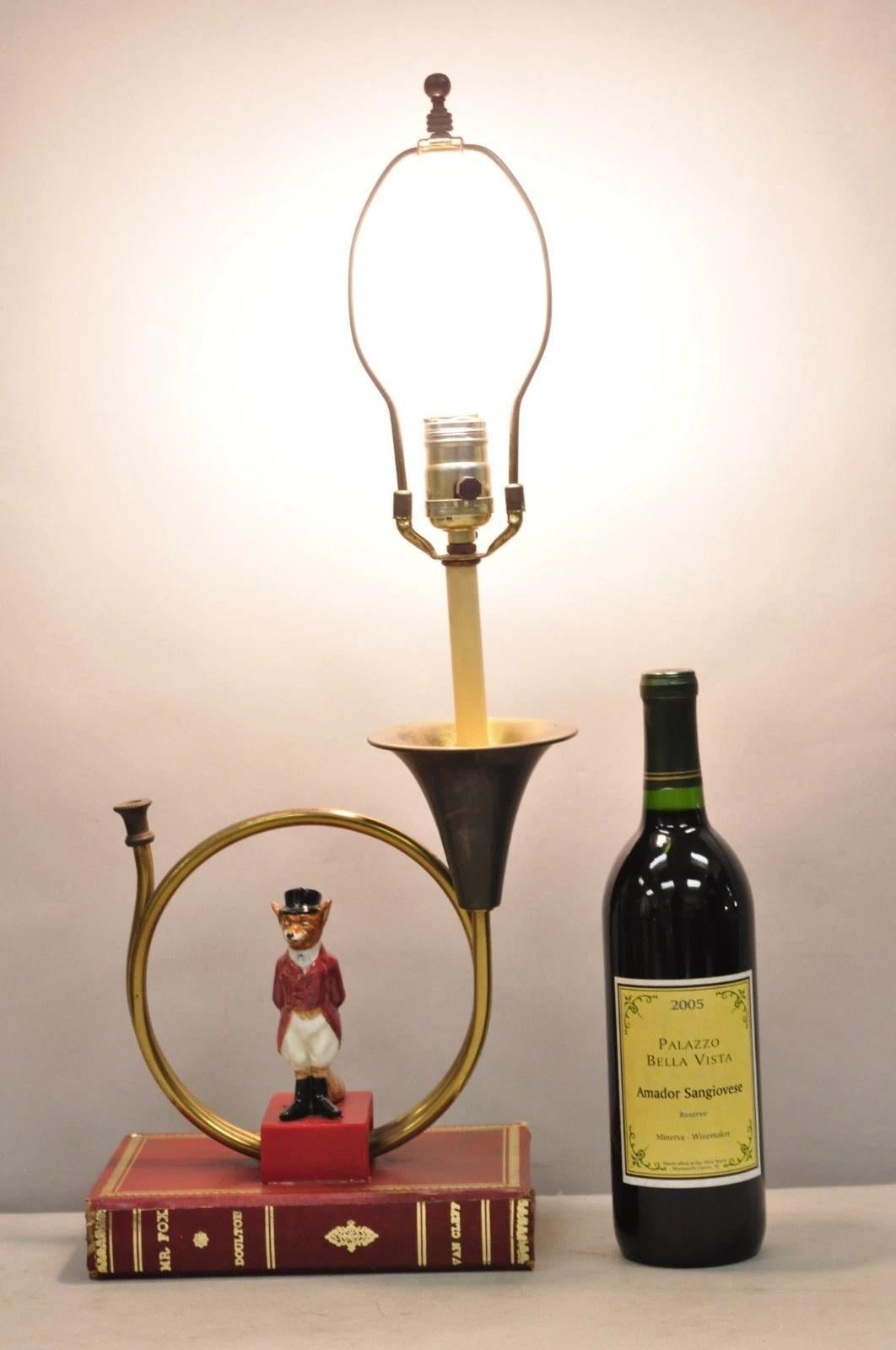 Vintage Equestrian Style Porcelain Snooty Mr. Fox Brass Trumpet on Red Book Figural Table Lamp. Circa Mid 20th Century. Measurements: 23
