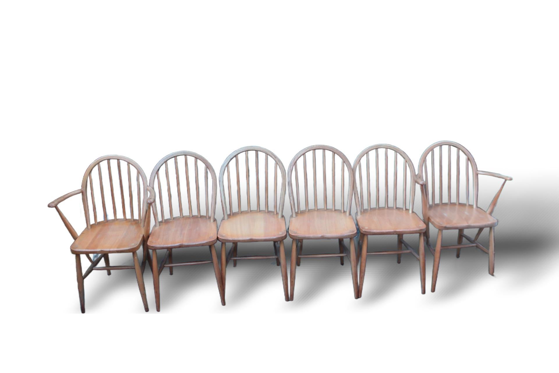 Vintage Ercol Hoop-Back Windsor Dining Chairs – Set of 6, Including Two Armchairs

This set of 6 vintage Ercol hoop-back Windsor dining chairs, including two armchairs, embodies the timeless elegance of mid-century British craftsmanship. Designed