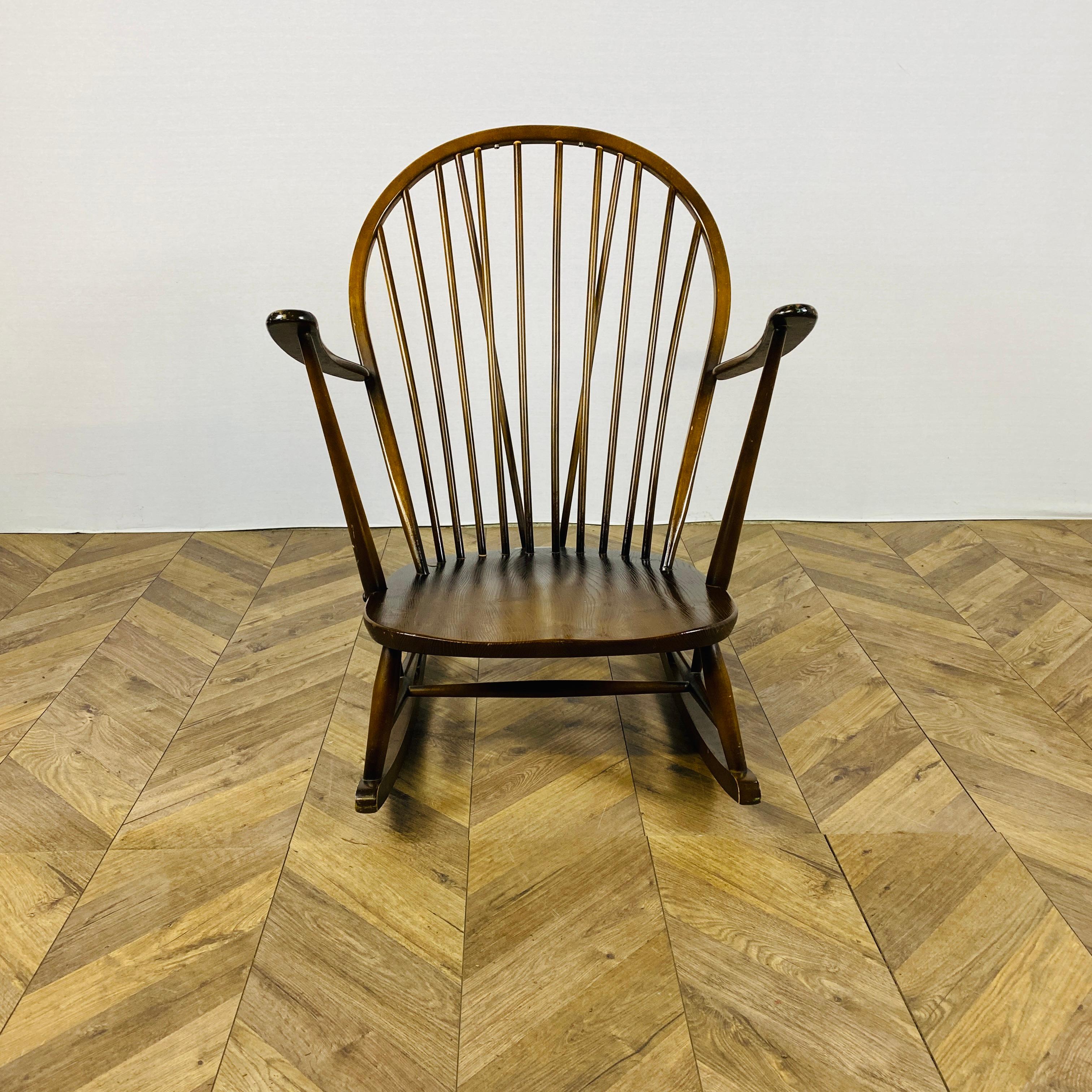A Lovely Large Ercol Windsor Grandfather Rocking Chair Model No. 315, circa 1960’s.


Designed by Lucian Ercolani, the rocking chair seamlessly blend contemporary British design and traditional craftsmanship. 

The chairs are made from solid