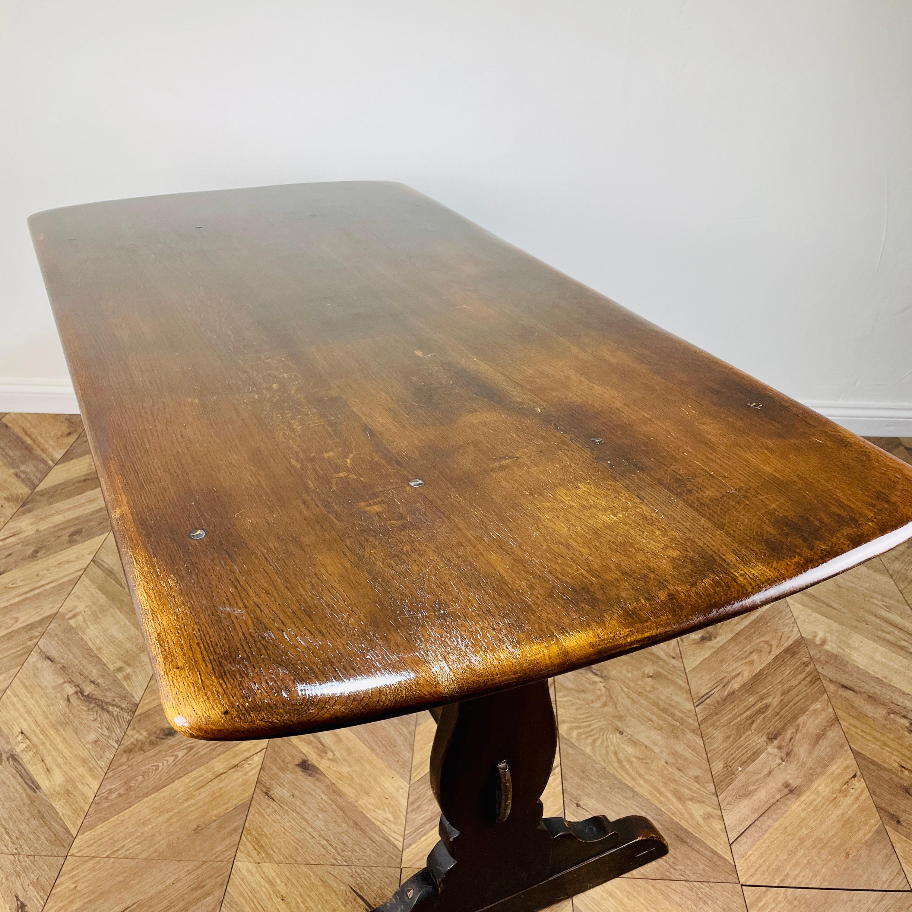 A Beautiful and Iconic, 1960s Ercol Refectory Table - Model Number 419

The table is from the company's popular Old Colonial range. Designed to sit up to six people, this is a classic piece from Ercol history.

The top is made from elm.

The