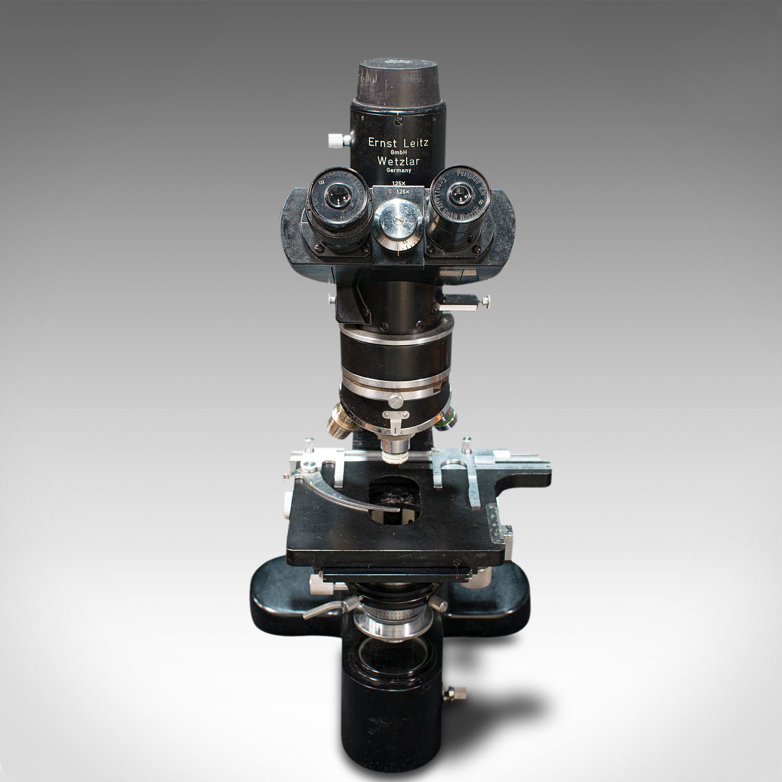 This is a vintage Ernst Leitz Microscope. A German, enamel coated alloy Dialux scientific instrument, dating to the mid 20th century, circa 1960.

Built to a standard not seen in the modern era and with myriad accessories
Displaying a desirable