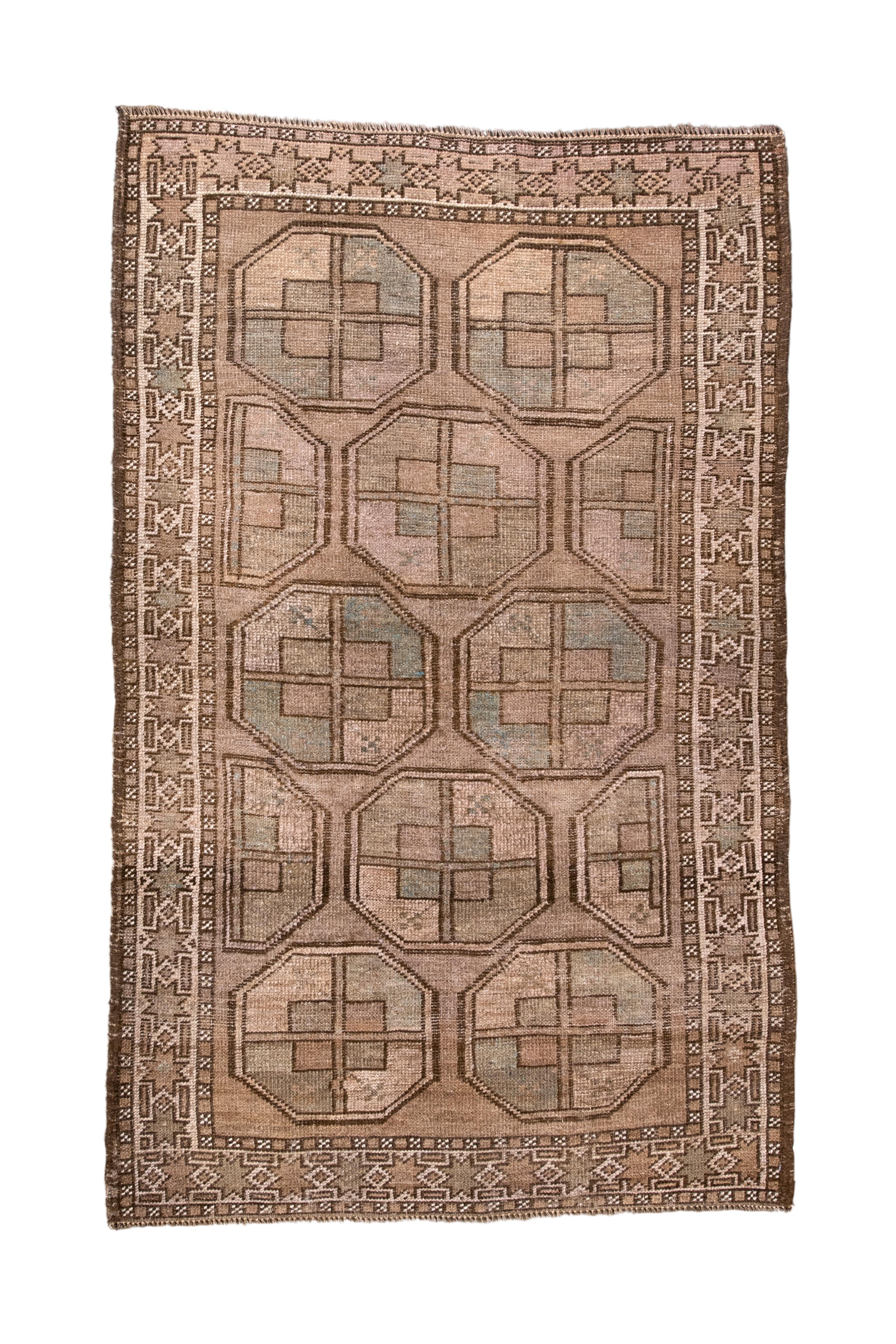The light brown field shows a compact, offset pattern of octagonal quartered guls. No minor guls. Caucasianoid ecru border of stars and short bars. All wool construction. 

Rug Size
2' 11