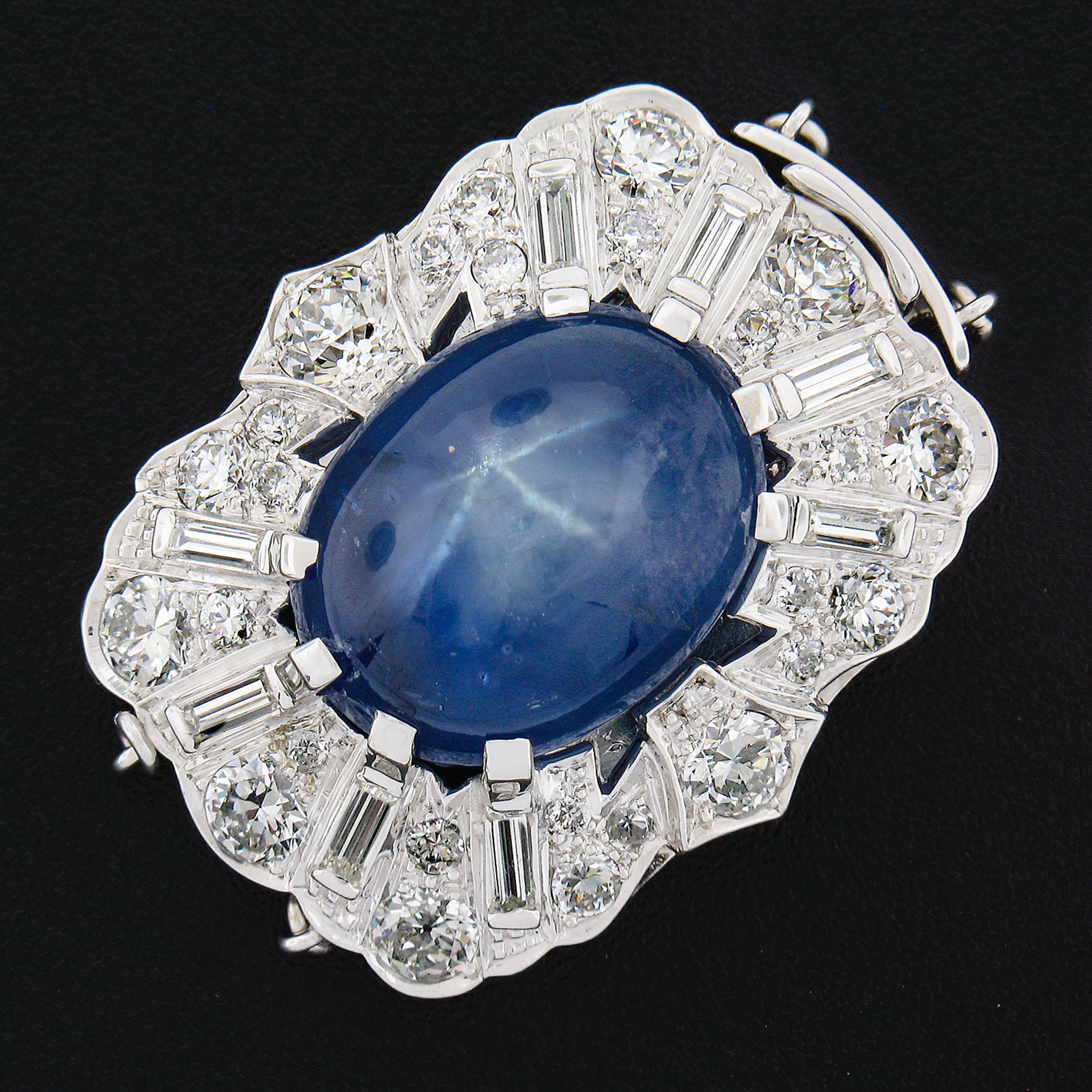 This is a truly jaw dropping and very well made midcentury two strand clasp that is designed by Erwin Reu Co. and crafted from solid 14k white gold. This large fancy clasp features a beautiful, GIA certified, star sapphire stone neatly prong set at