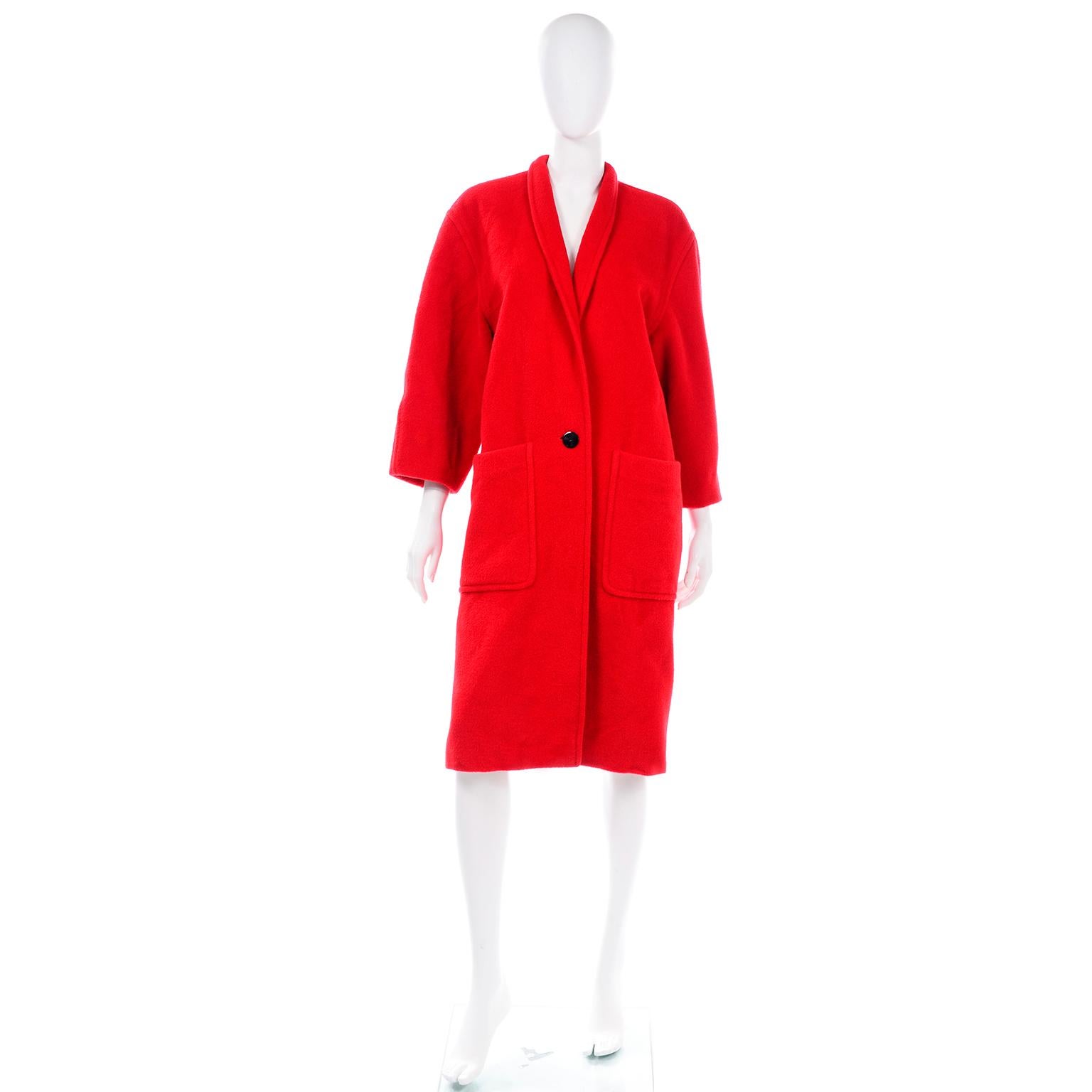 We love this incredible red oversized Escada vintage coat, designed by Margaretha Ley. The red blend 30% Lama 25% New Wool 25% Alpaca 20% Mohair. is slightly felted and textured. This coat has a shawl collar that can easily be folded down for a more