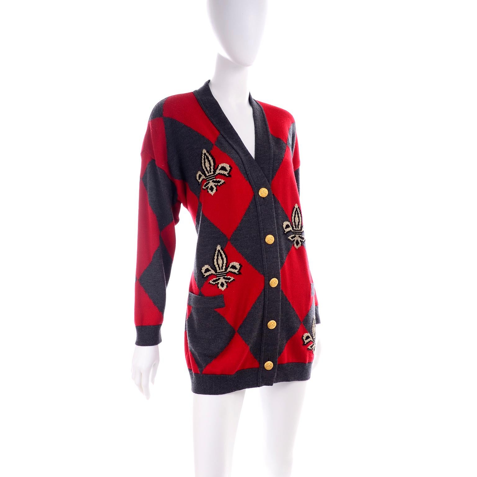 We love vintage Escada sweaters and blouses!  This button front cardigan is made of 96% new wool, 2% Cupro and 2% Polyester.  Labeled a size 36, this sweater has 2 functional pockets and 5 gold fleur de lis buttons and was made in Germany in the