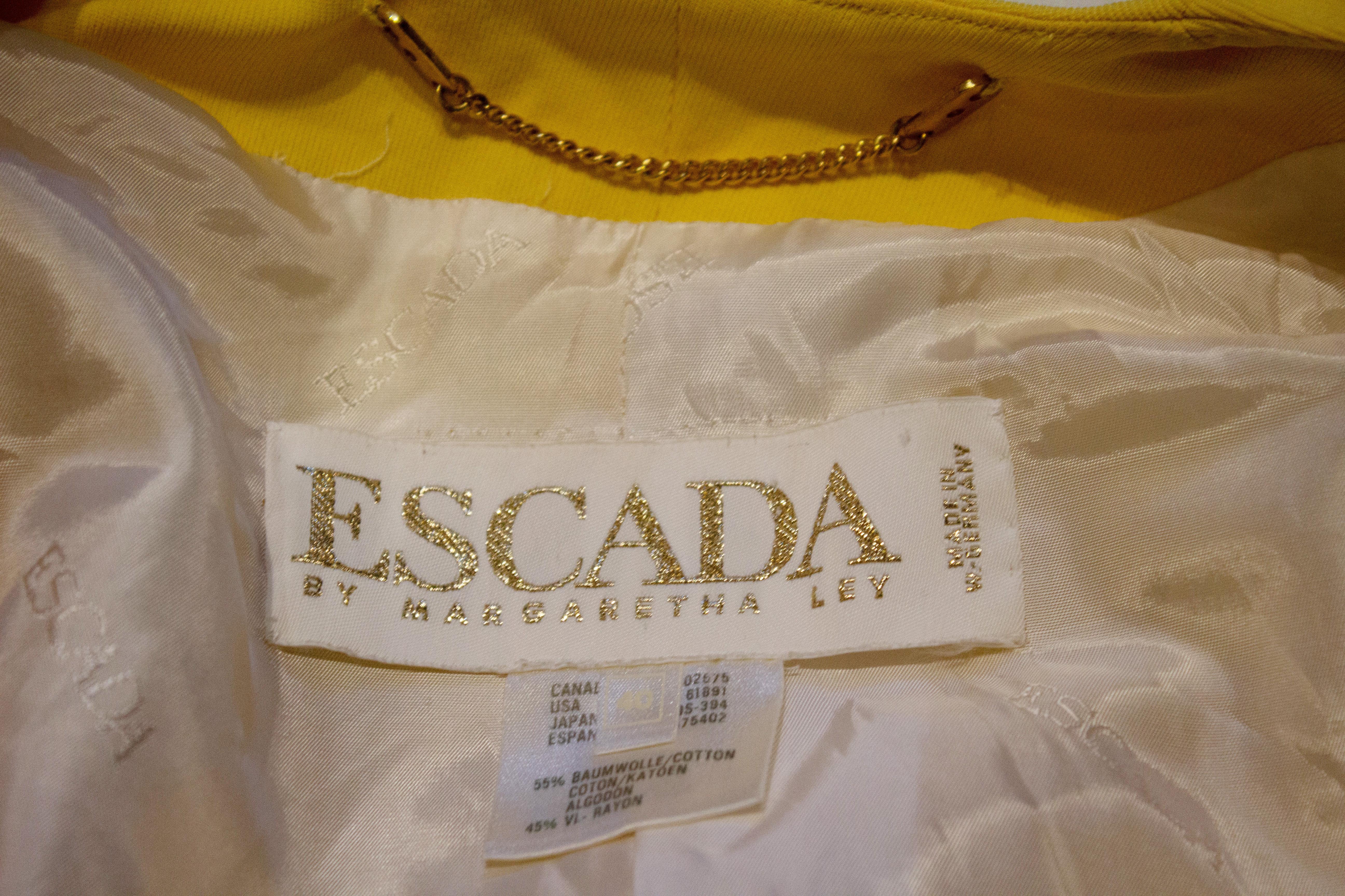 A charming vintage bolero by Escada. In a bright yellow , the bolero is in a cotton mix ,fully lined and size 40 Measurements shoulder to shoulder 17'',length 17''