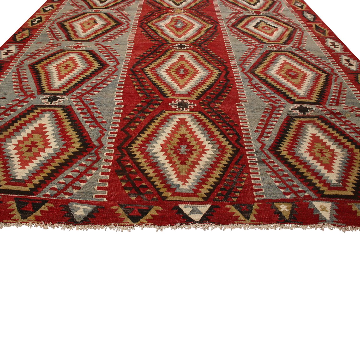 Flat-woven in high-quality wool originating from Turkey between 1930-1940, this vintage Esme Kilim rug hosts one of the more uncommon, individualistic arrays of colorways among its era, balancing an accenting presence of rich red and black with