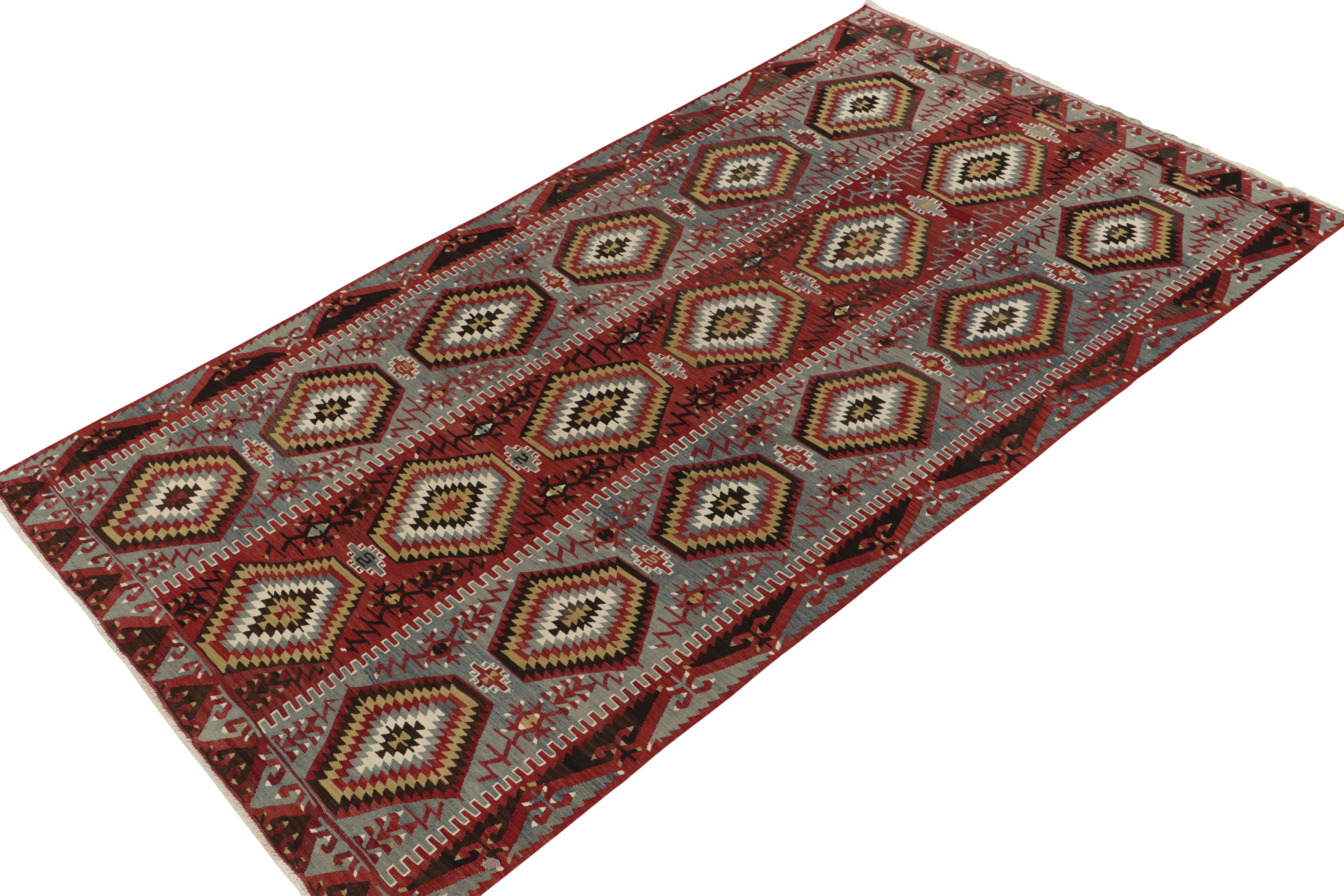 Hailing from Turkey circa 1940s, a mid-century kilim rug now joining Rug & Kilim’s vintage tribal selections. Specifically an Esme Kilim, this edition of the coveted regional style revels in rare blue tones with red, white, black & beige rendering a