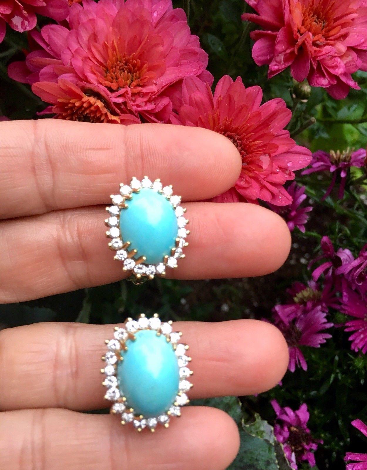 Stunning and elegant 14 karat gold pierced earrings set with 18 carats of oval cabochon turquoise and 1.75 carats of round brilliant cut diamonds, with H color and VS2-SI1 Clarity. Sparkly and white!! 

The earrings are tested for 14K purity.  They