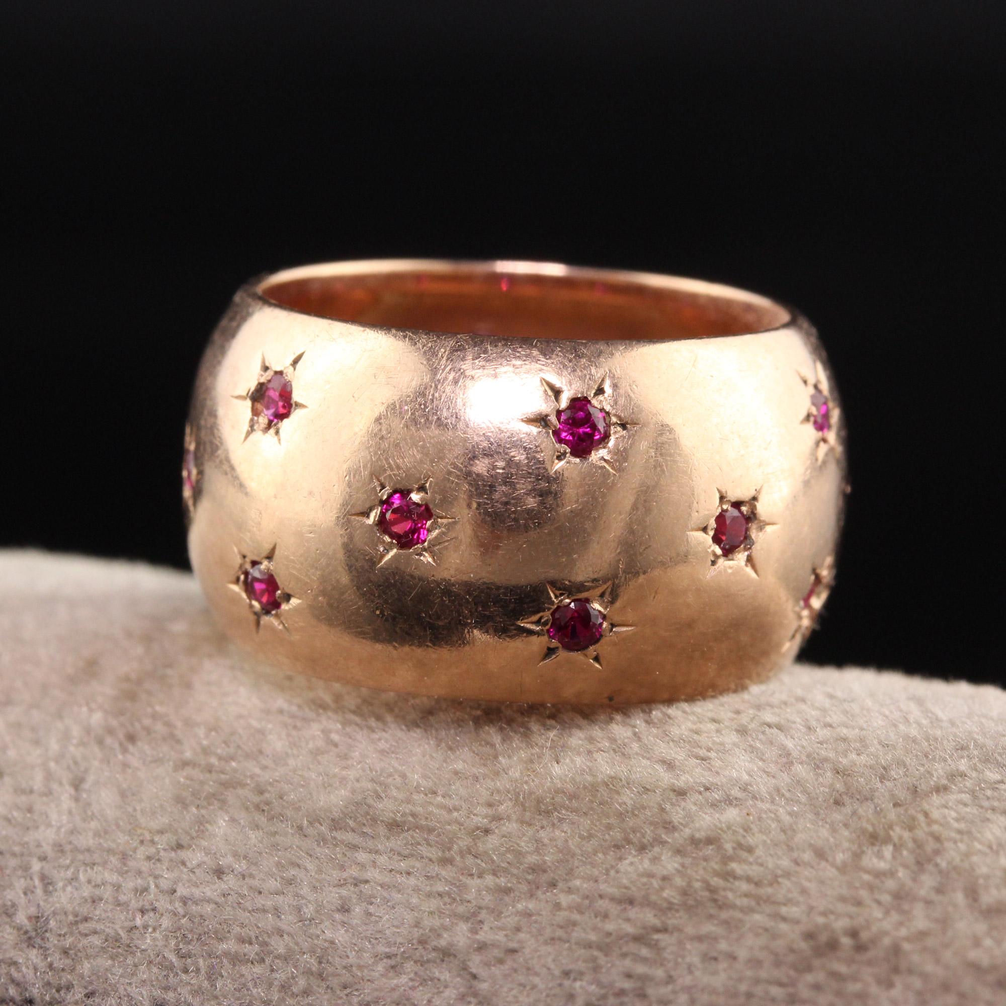 Beautiful Vintage Estate 14K Rose Gold Ruby Star Pattern Wide Wedding Band. This beautiful wedding band features natural rubies in a star setting going around the entire ring. It is crafted in 14K rose gold.

Item #R1156

Metal: 14K Rose